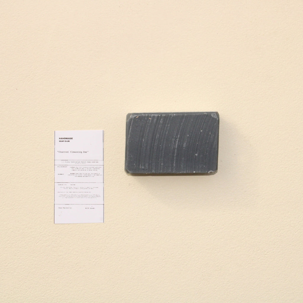 Lifestyle photo showing Detoxifying Charcoal Cleansing Bar in use - Handmade Soap Club