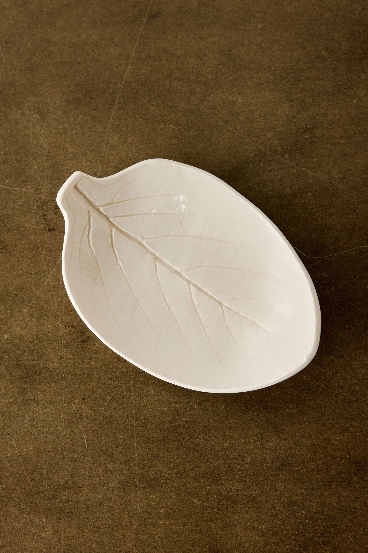 Lifestyle photo showing Porcelain Leaf Trinket Dish in use - Kanju Interiors