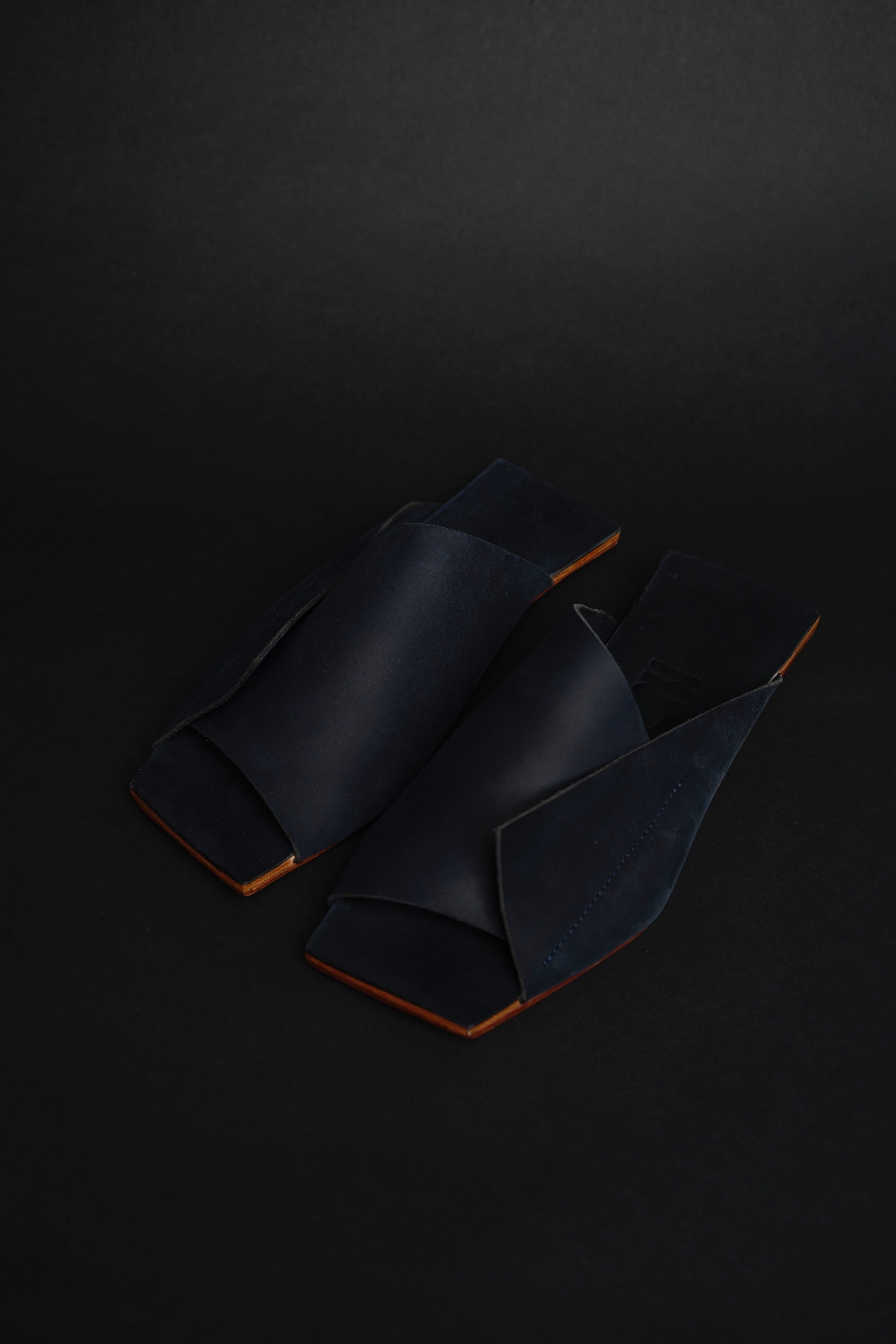Close-up detail showing quality craftsmanship and materials - Amos Handcrafted Navy Leather Slides