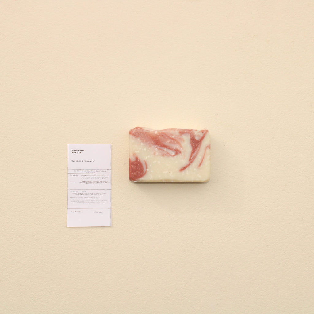 Lifestyle photo showing Sea Salt + Rosemary Exfoliating Bar in use - Handmade Soap Club