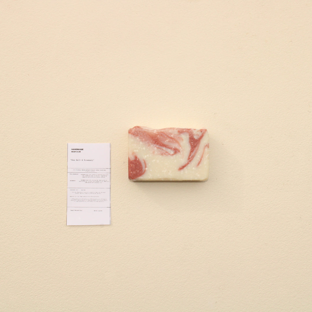 Lifestyle photo showing Sea Salt + Rosemary Exfoliating Bar in use - Handmade Soap Club