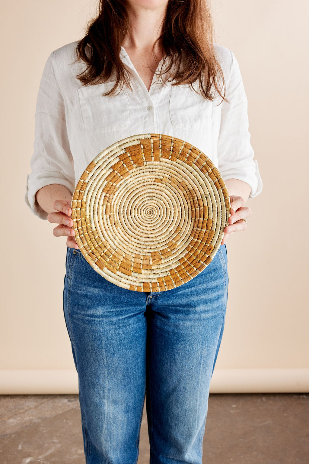 Lifestyle photo showing Bahari Banana Bark Wall Basket in use - Kanju Interiors