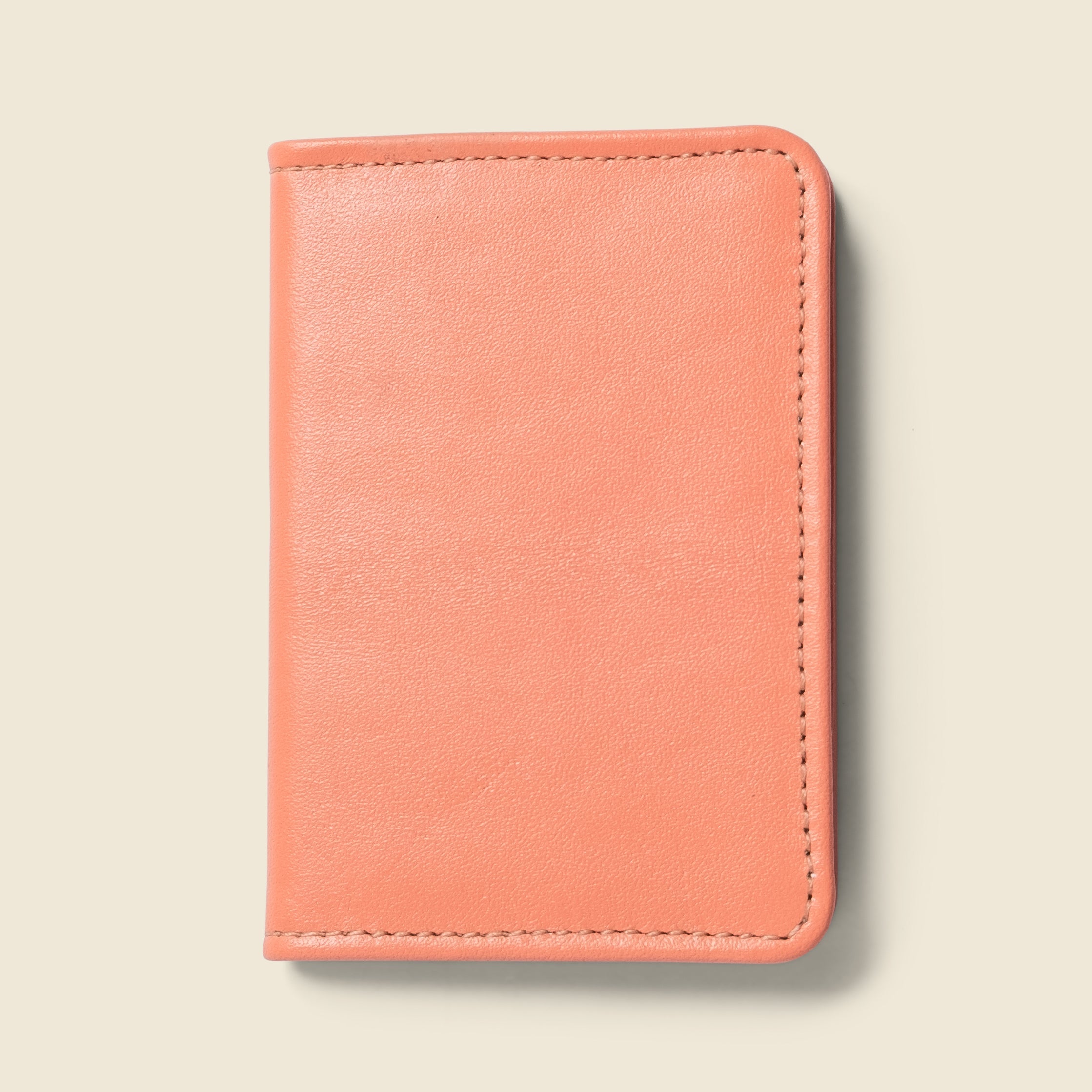 Lifestyle photo showing Compact Bifold with RFID Protection - Pink in use - CASUPO