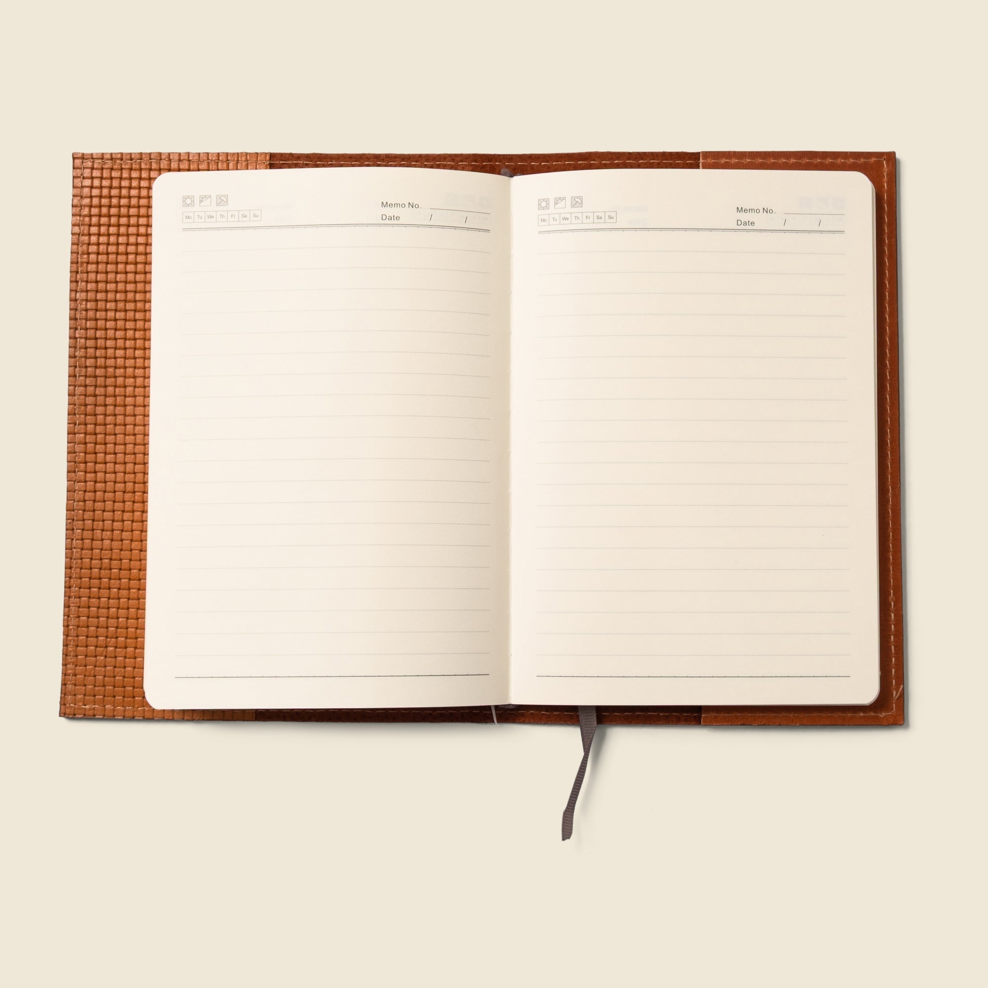 Lifestyle photo showing Refillable A5 Leather Notebook Cover – Tan Limited Edition in use - CASUPO
