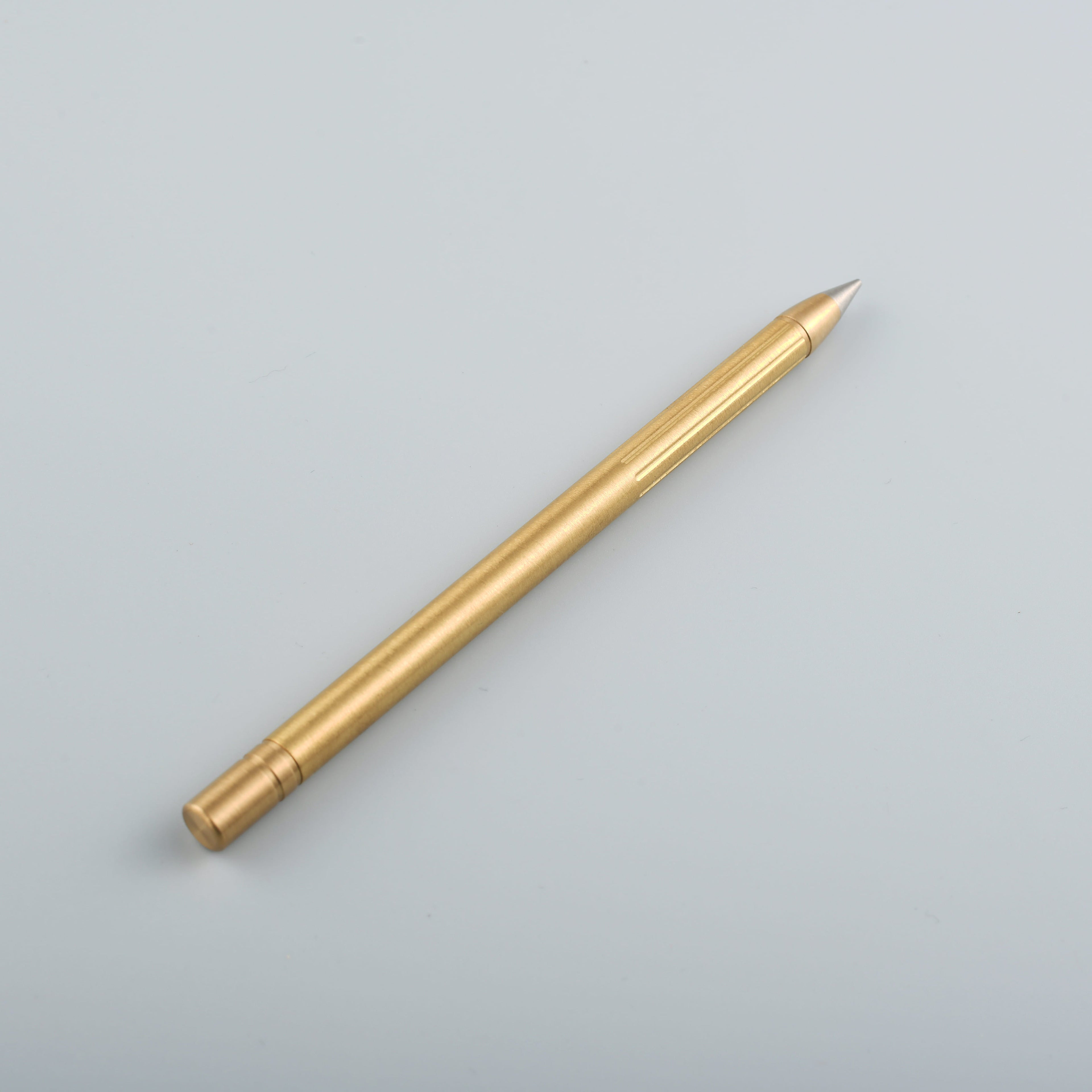 Lifestyle photo showing Omega Pen // Copper in use - UNCOMMONCARRY