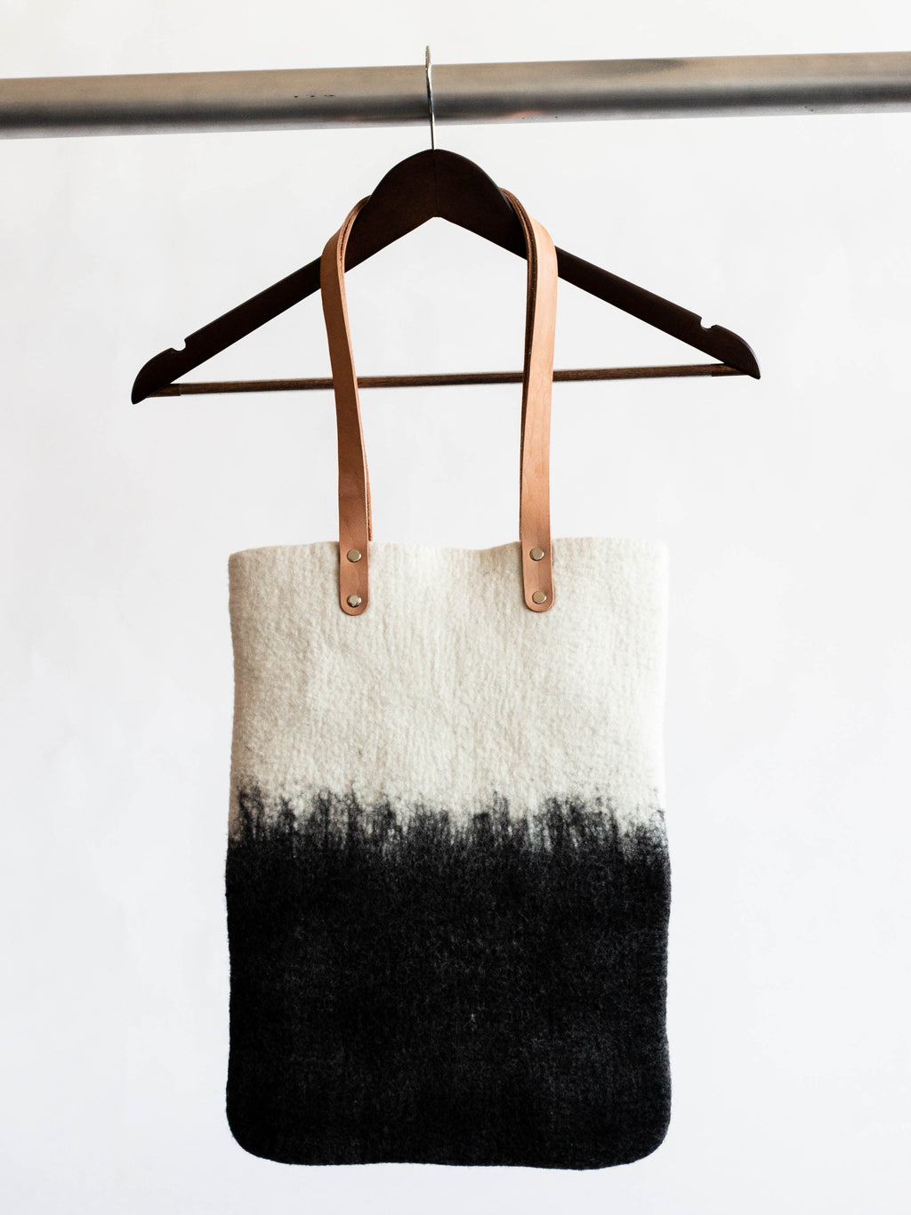 Lifestyle photo showing Eclipse Hand-Felted Wool Tote in use - Kanju Interiors