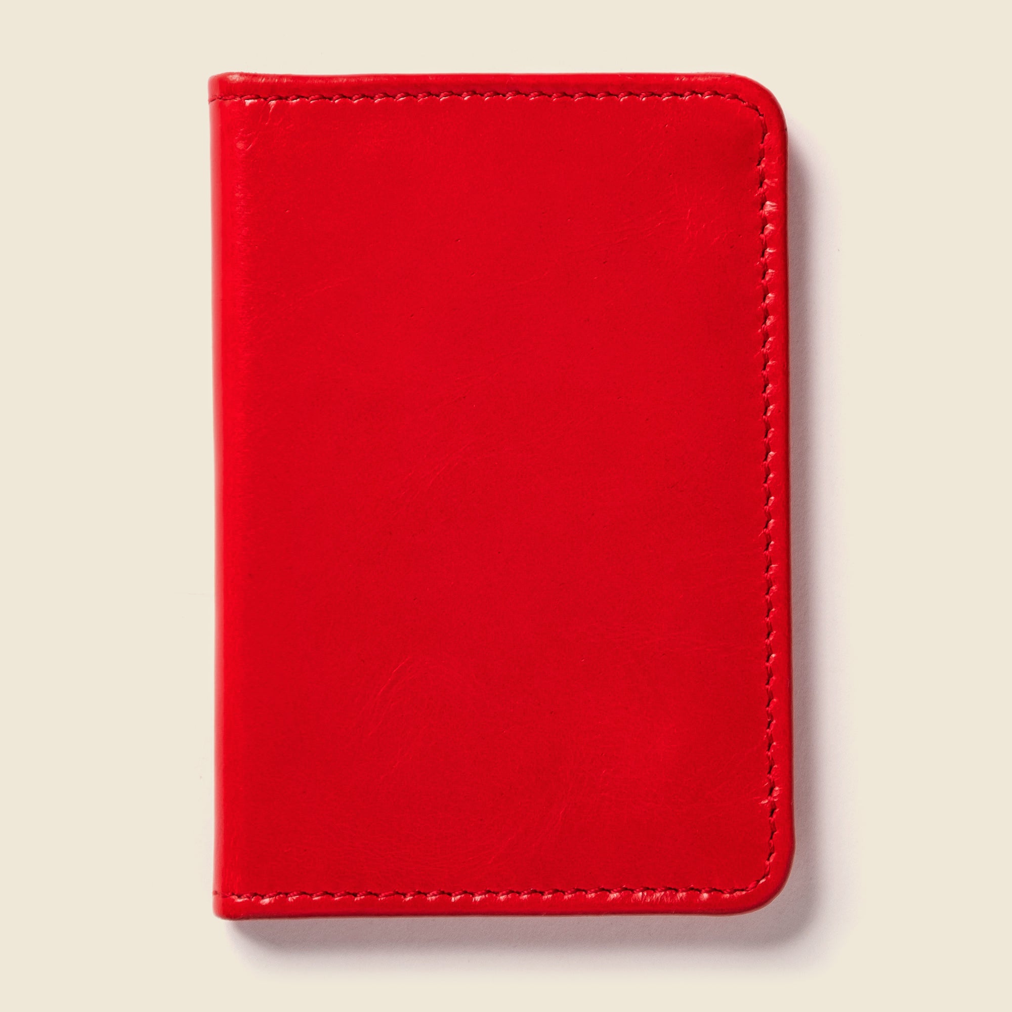 Lifestyle photo showing Compact Bifold with RFID Protection - Fire Red in use - CASUPO