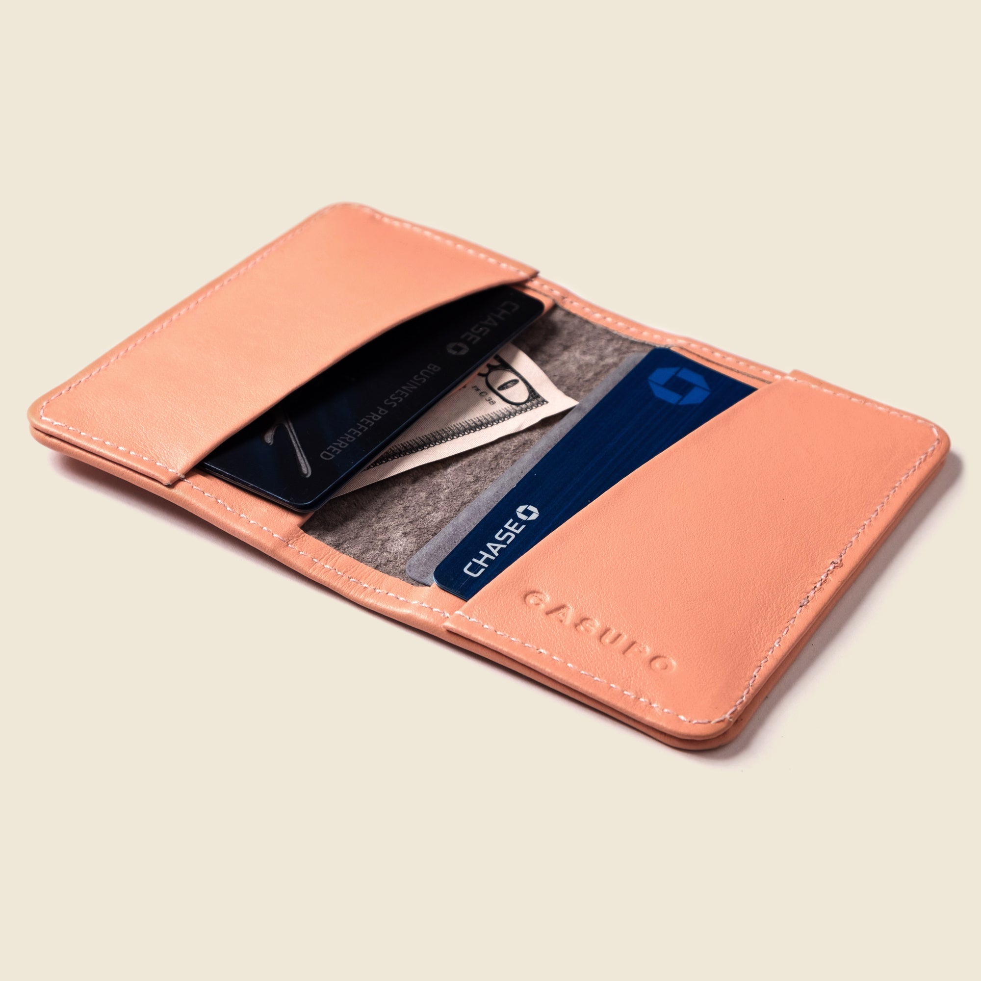 Lifestyle photo showing Compact Bifold with RFID Protection - Soft Pink in use - CASUPO