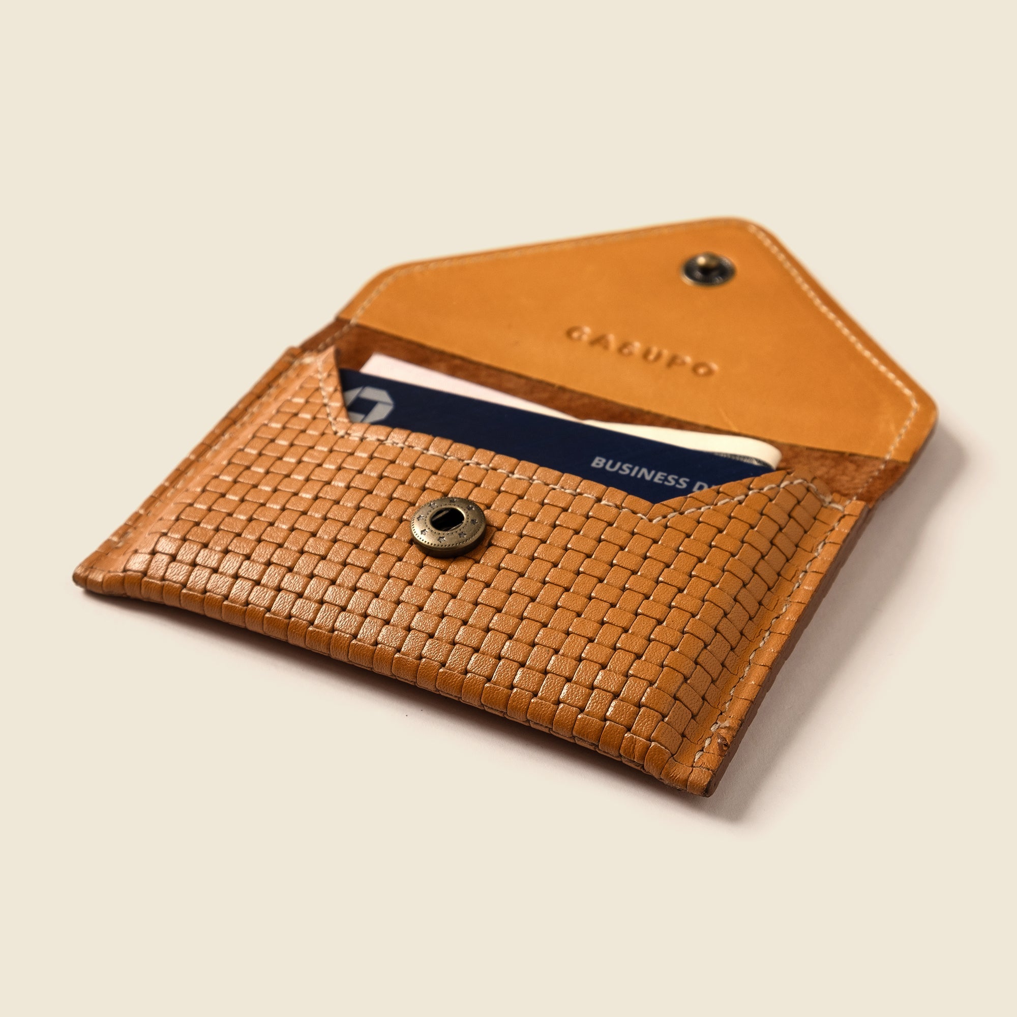Lifestyle photo showing Mini Envelope Wallet With RFID protection - Tan Limited Edition in use - CASUPO