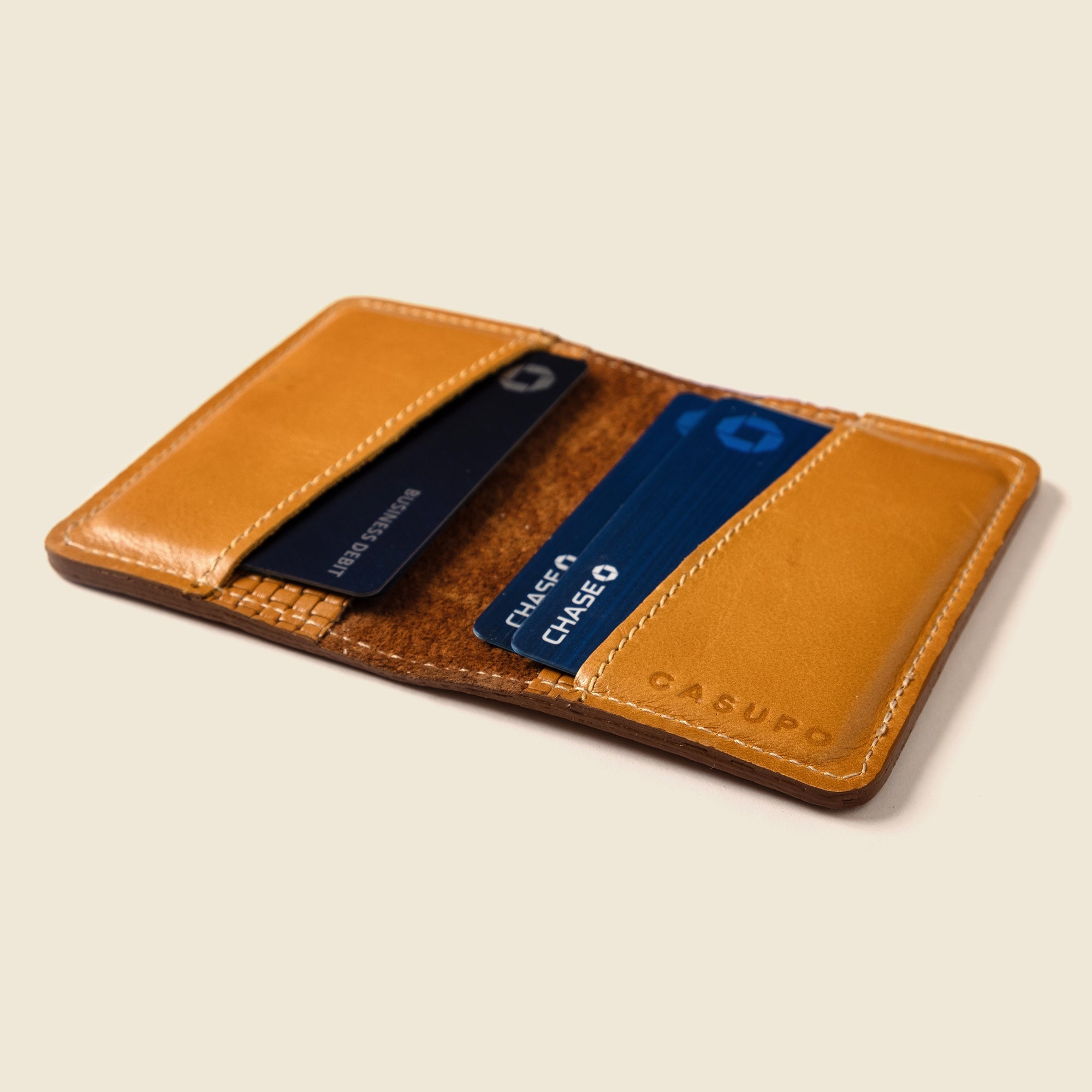 Lifestyle photo showing Compact Bifold with RFID Protection - Tan Limited Edition in use - CASUPO