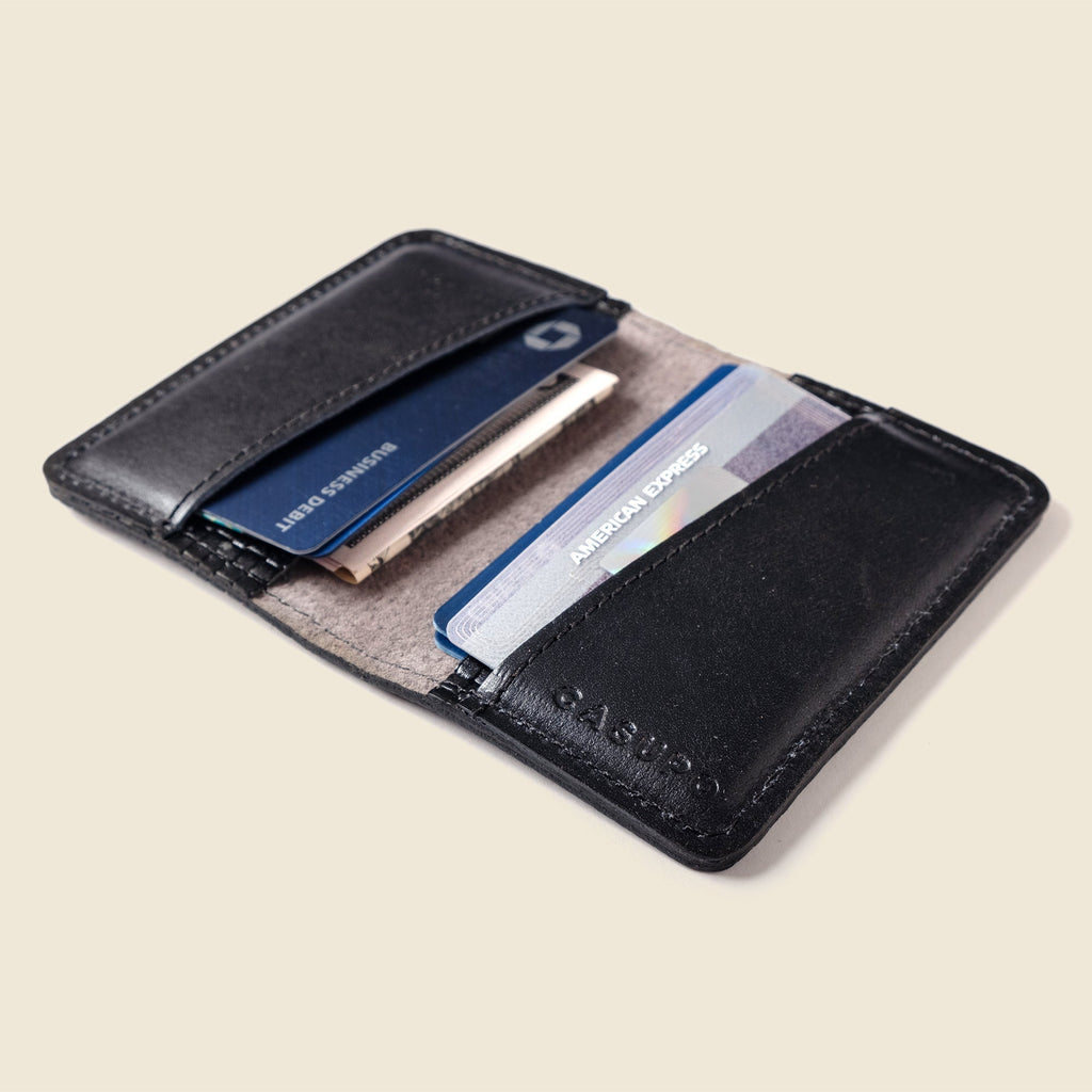 Lifestyle photo showing Compact Bifold with RFID Protection - Black Limited Edition in use - CASUPO
