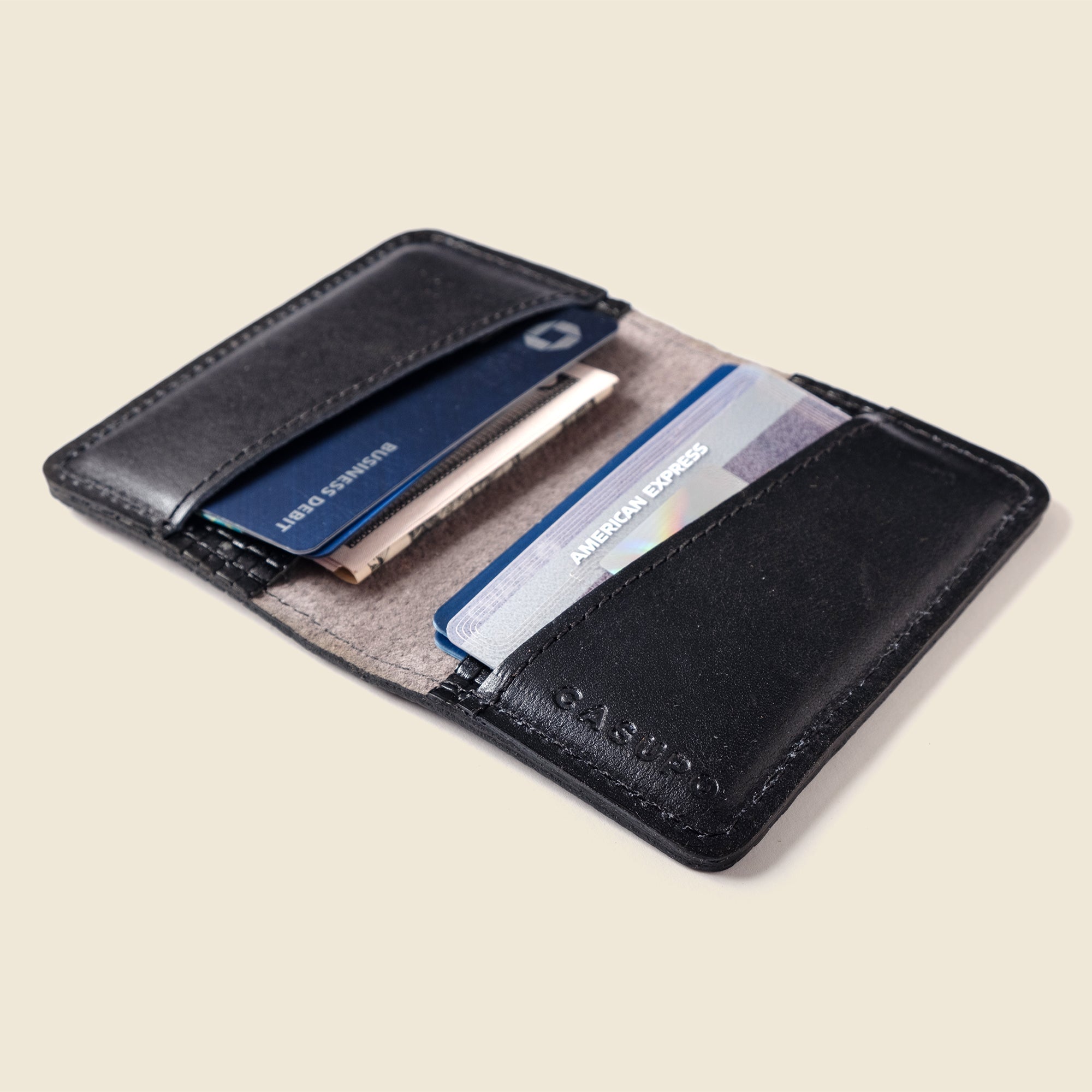 Lifestyle photo showing Compact Bifold with RFID Protection - Black Limited Edition in use - CASUPO
