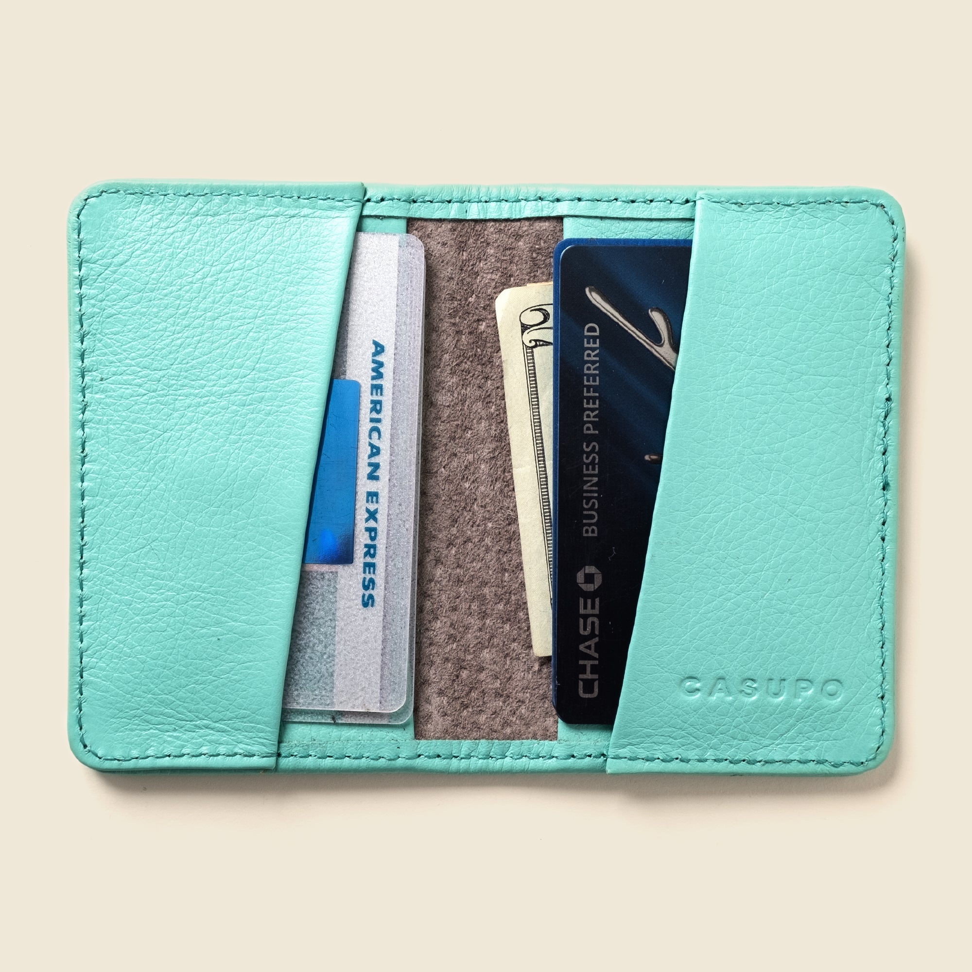 Lifestyle photo showing Compact Bifold with RFID Protection - Baby Blue in use - CASUPO