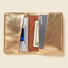 Lifestyle photo showing Compact Bifold with RFID Protection - Gold in use - CASUPO