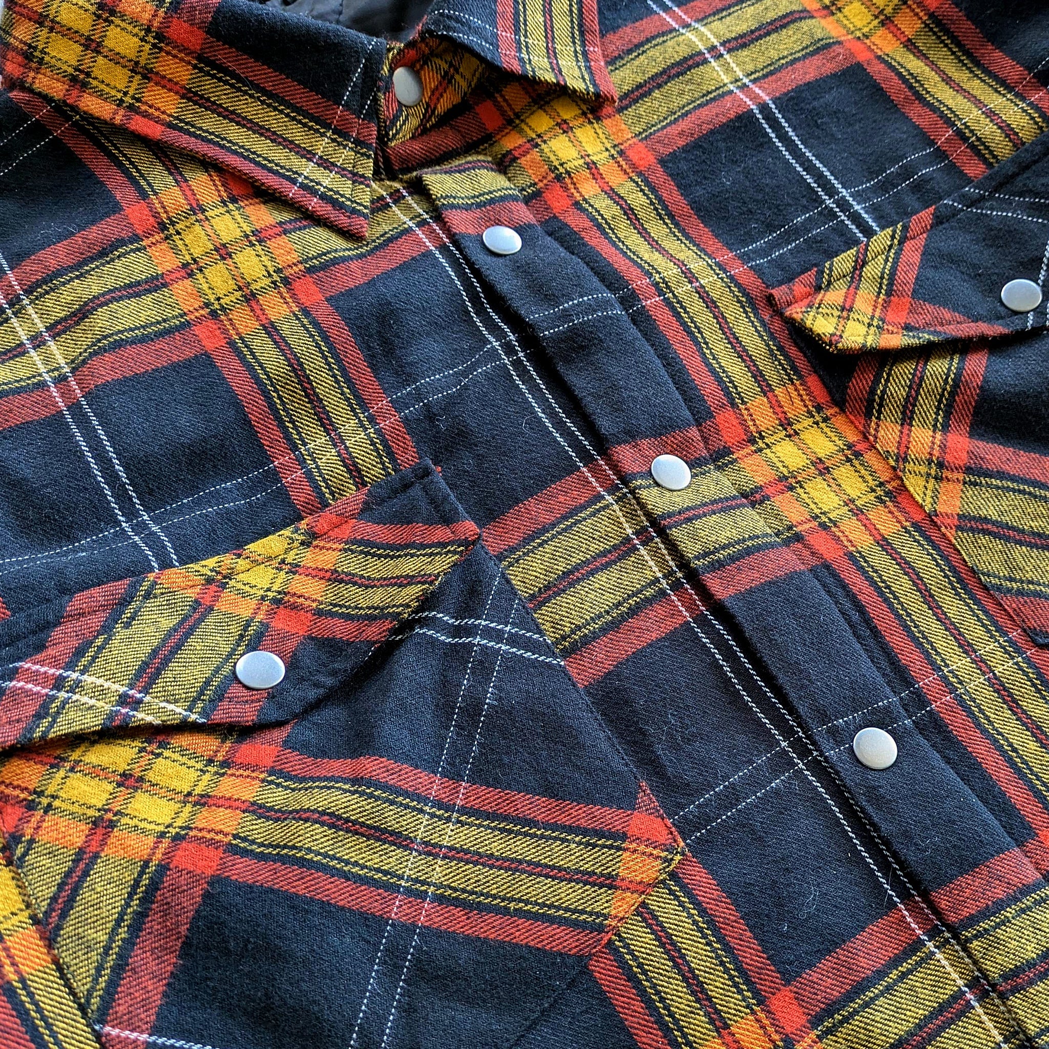 Lifestyle photo showing Juniper Insulated Flannel Shacket - Black/Red/Yellow in use - Faultline395