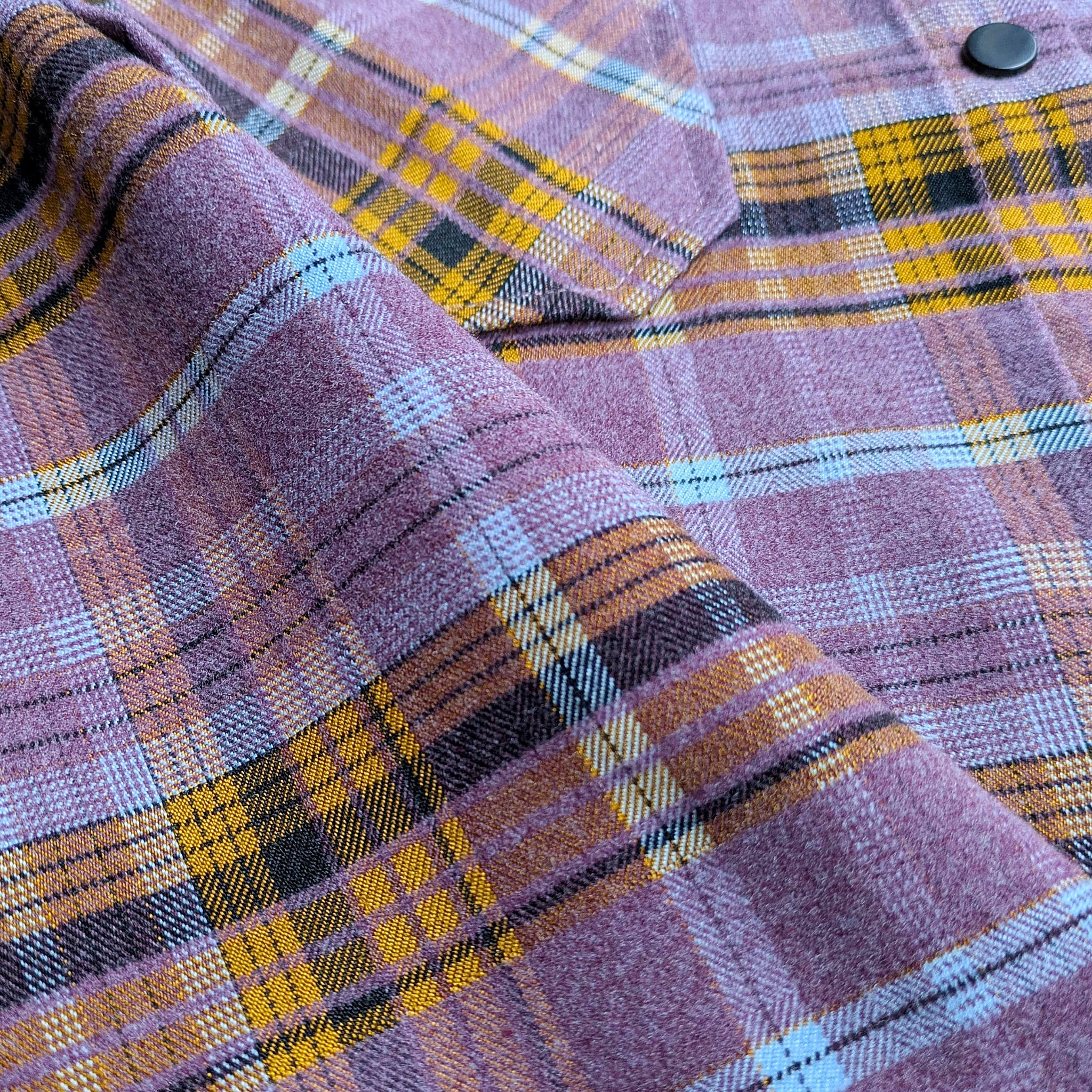 Lifestyle photo showing Women's Highland Tech Flannel - Wildflower in use - Faultline395