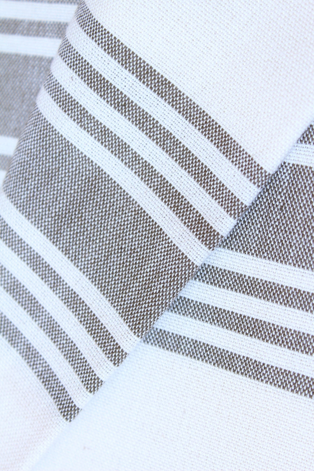 Lifestyle photo showing Figueres - White in use - Beach House Towels
