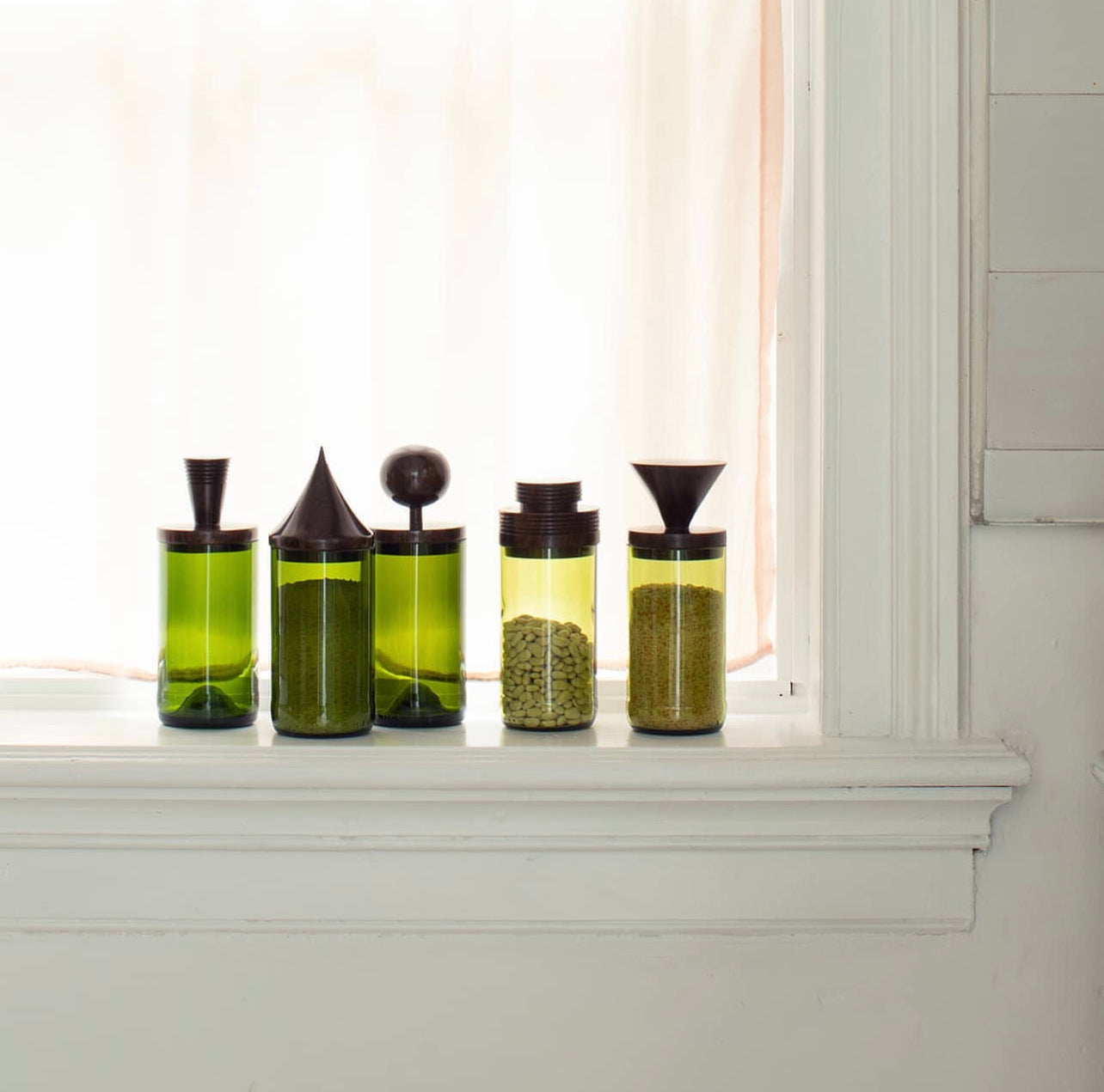 Lifestyle photo showing Wooden Topped Green Apothecary Jars in use - Kanju Interiors