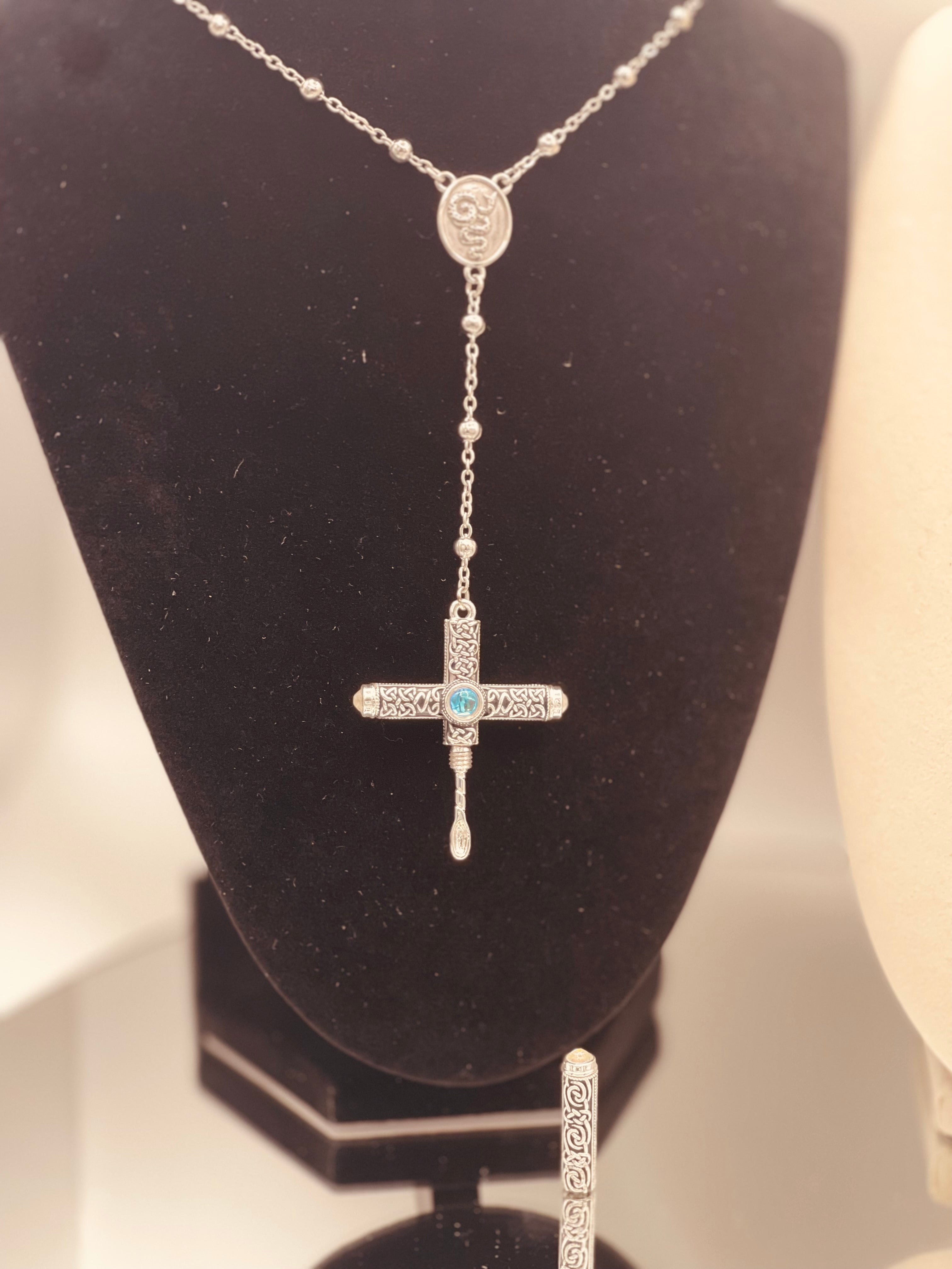 Lifestyle photo showing Stash Necklace - Cruel Intentions Inspired Cross in use - Barkley Design