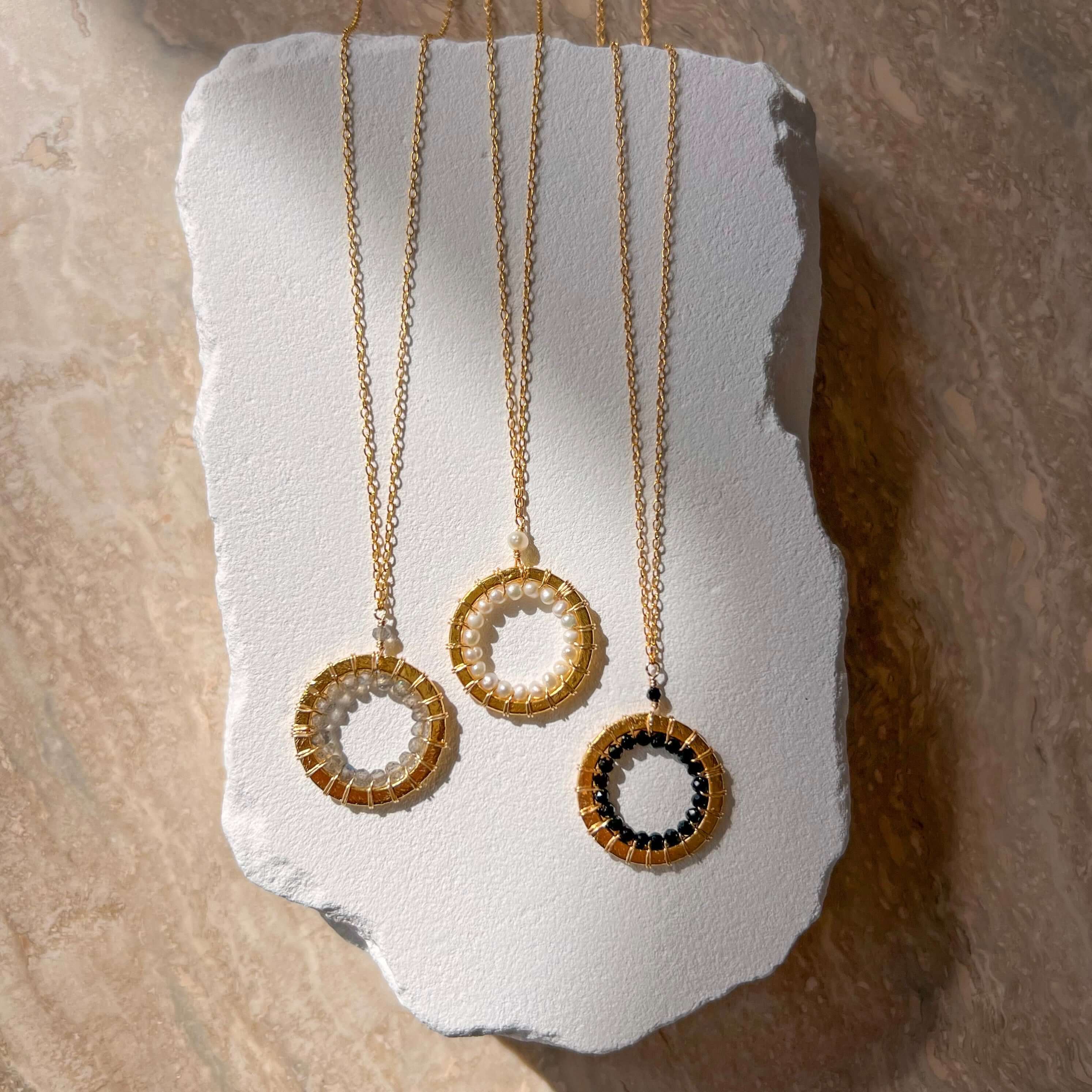 Lifestyle photo showing PARKEN JEWELRY Pearl, Labradorite and Black Spinel Halo Mini Gold in use - PARKEN JEWELRY