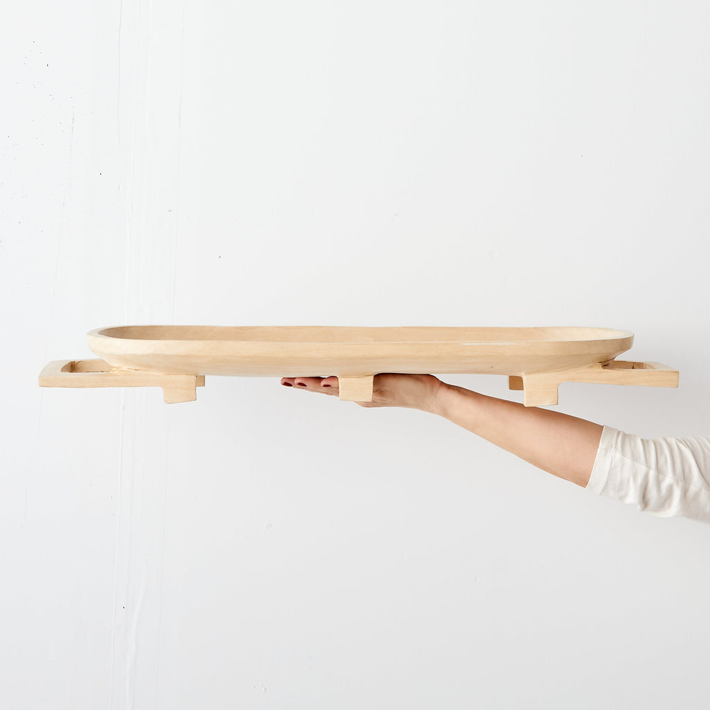 Lifestyle photo showing Swazi Long Wooden Serving Tray in use - Kanju Interiors