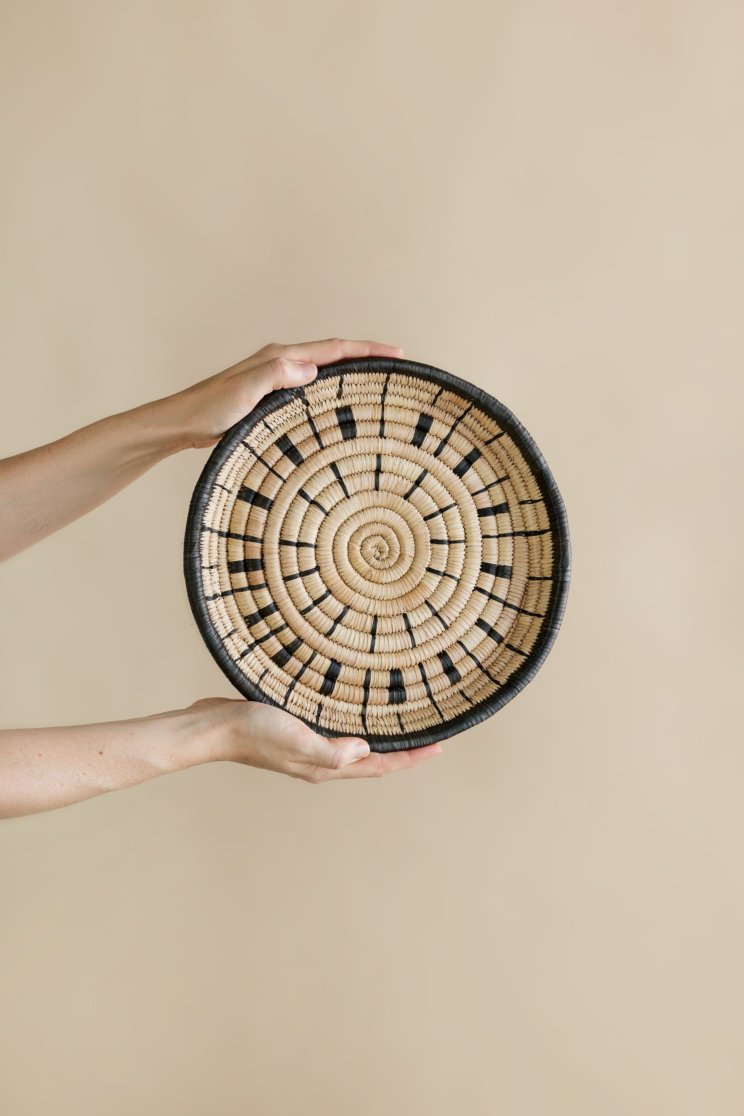 Lifestyle photo showing Lero Woven Wall Disc in use - Kanju Interiors