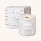 Lifestyle photo showing Lucienne - Santal Rosé Candle in use - LA JOLIE MUSE