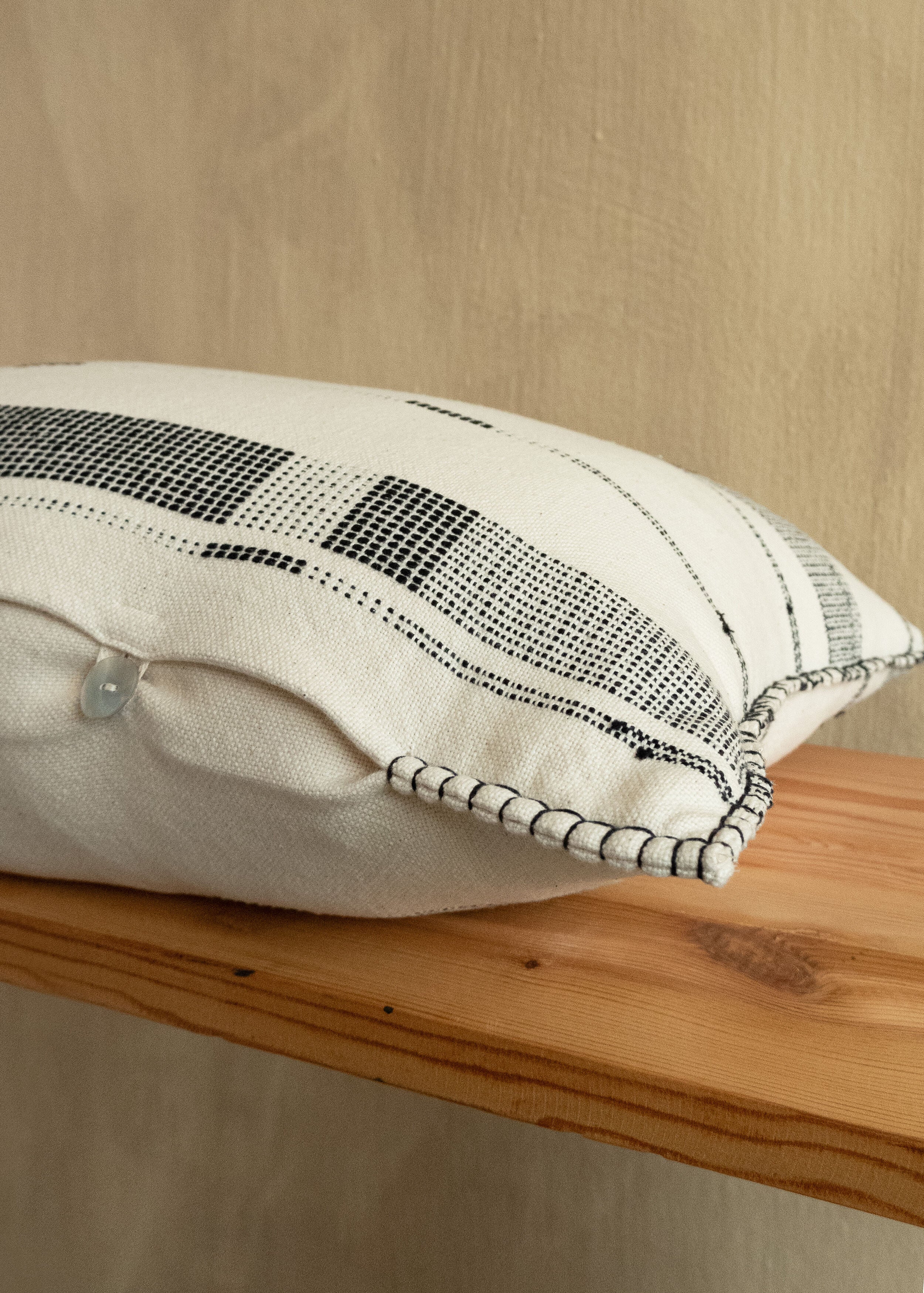Lifestyle photo showing Fulcrum Onyx Oversized Cotton Lumbar Pillow in use - Kanju Interiors