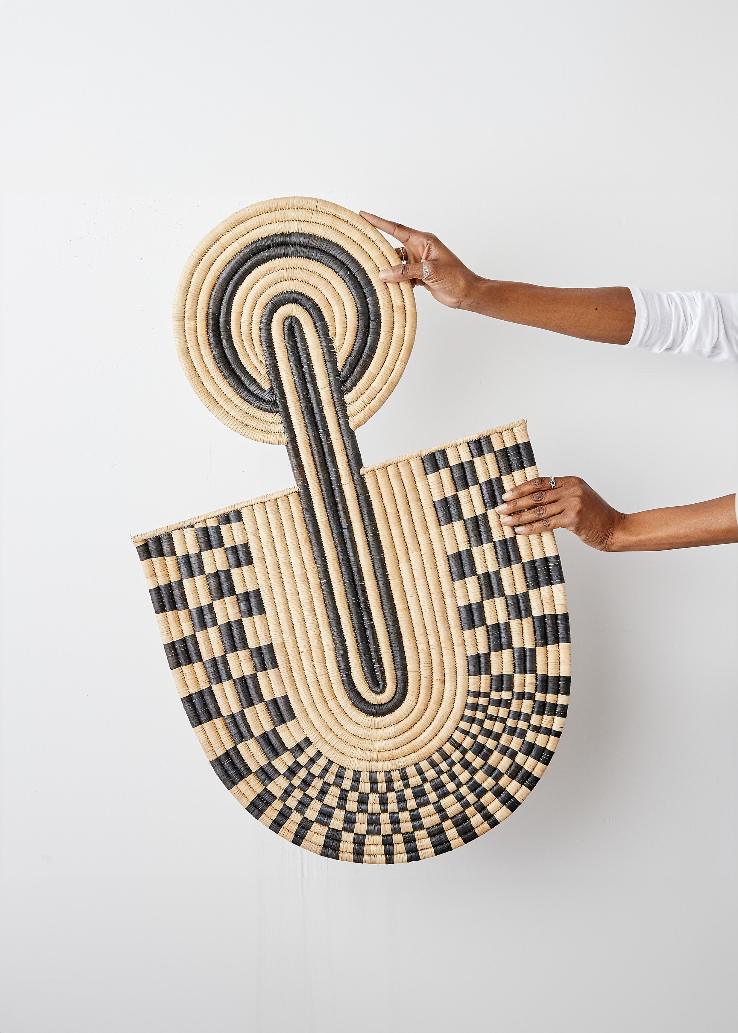 Lifestyle photo showing Maravi Patterned Black & Natural Woven Wall Art in use - Kanju Interiors