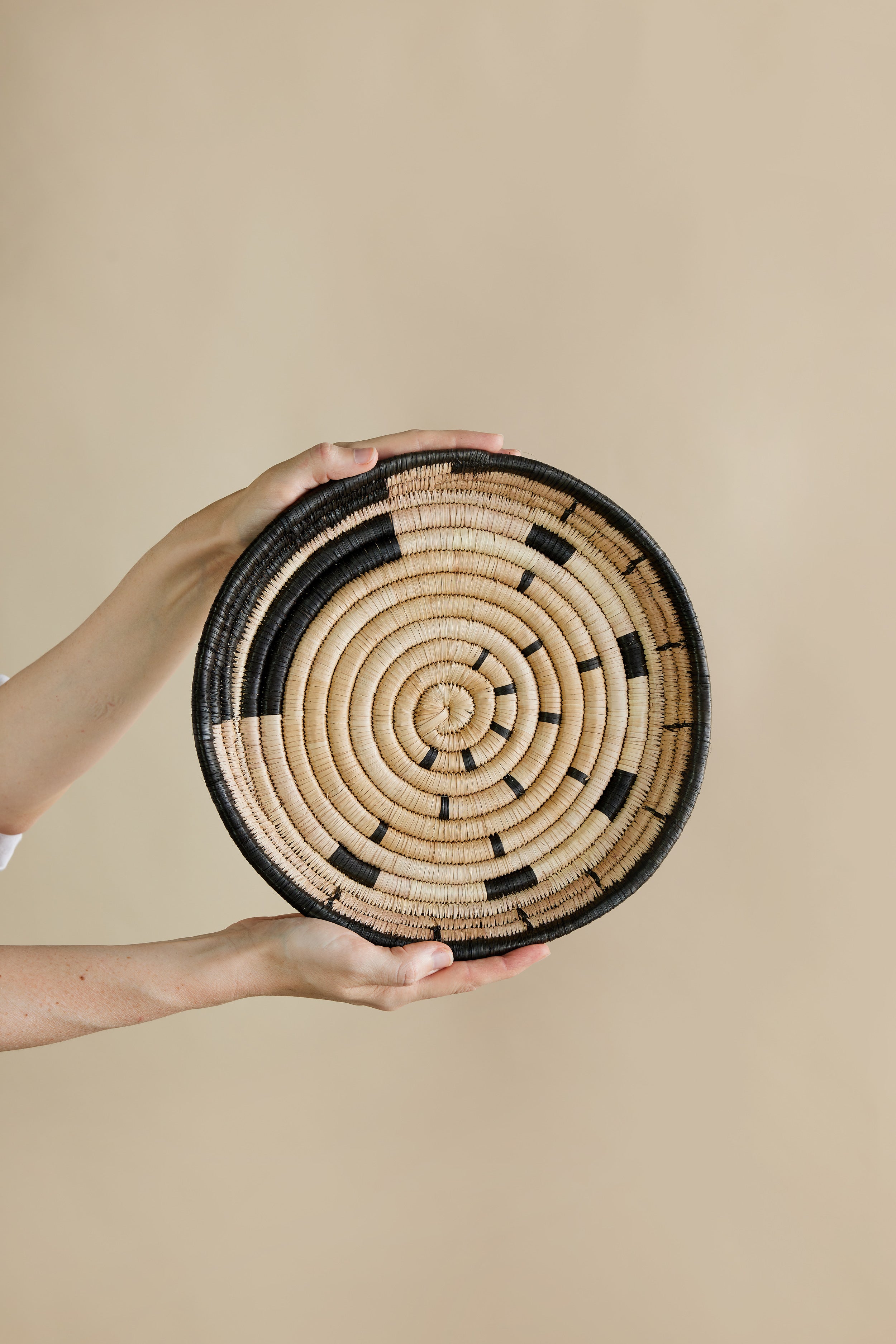Lifestyle photo showing Mawa Woven Wall Disc in use - Kanju Interiors