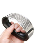 Lifestyle photo showing Stainless Steel Garlic Press in use - Choixe