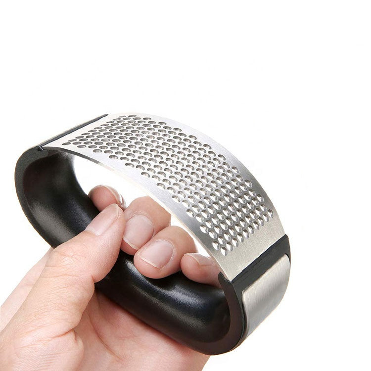 Lifestyle photo showing Stainless Steel Garlic Press in use - Choixe