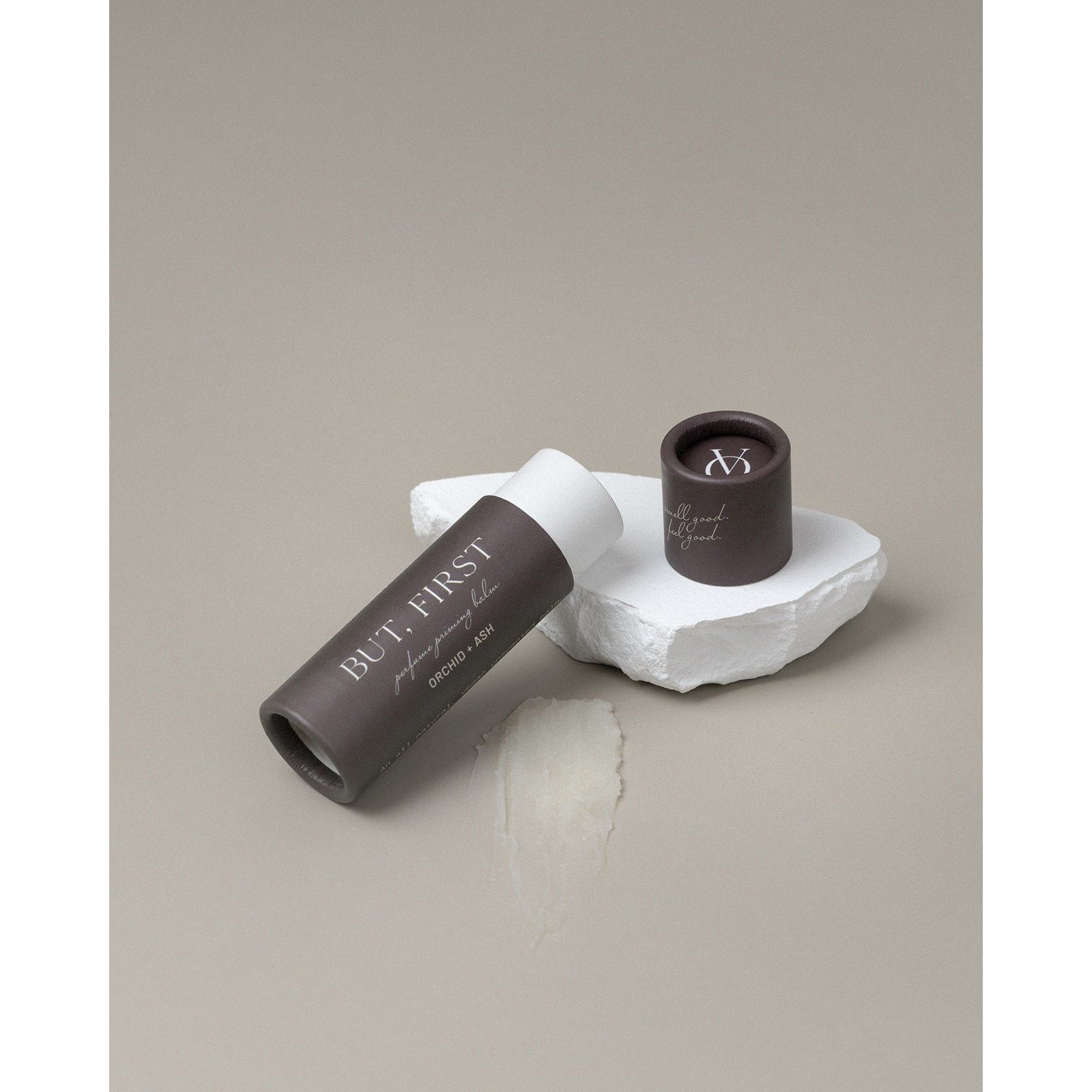 Lifestyle photo showing BUT, FIRST Perfume Priming Balm in use - Orchid + Ash