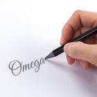 Lifestyle photo showing OMEGA AXL PEN SERIES 1 in use - UNCOMMONCARRY
