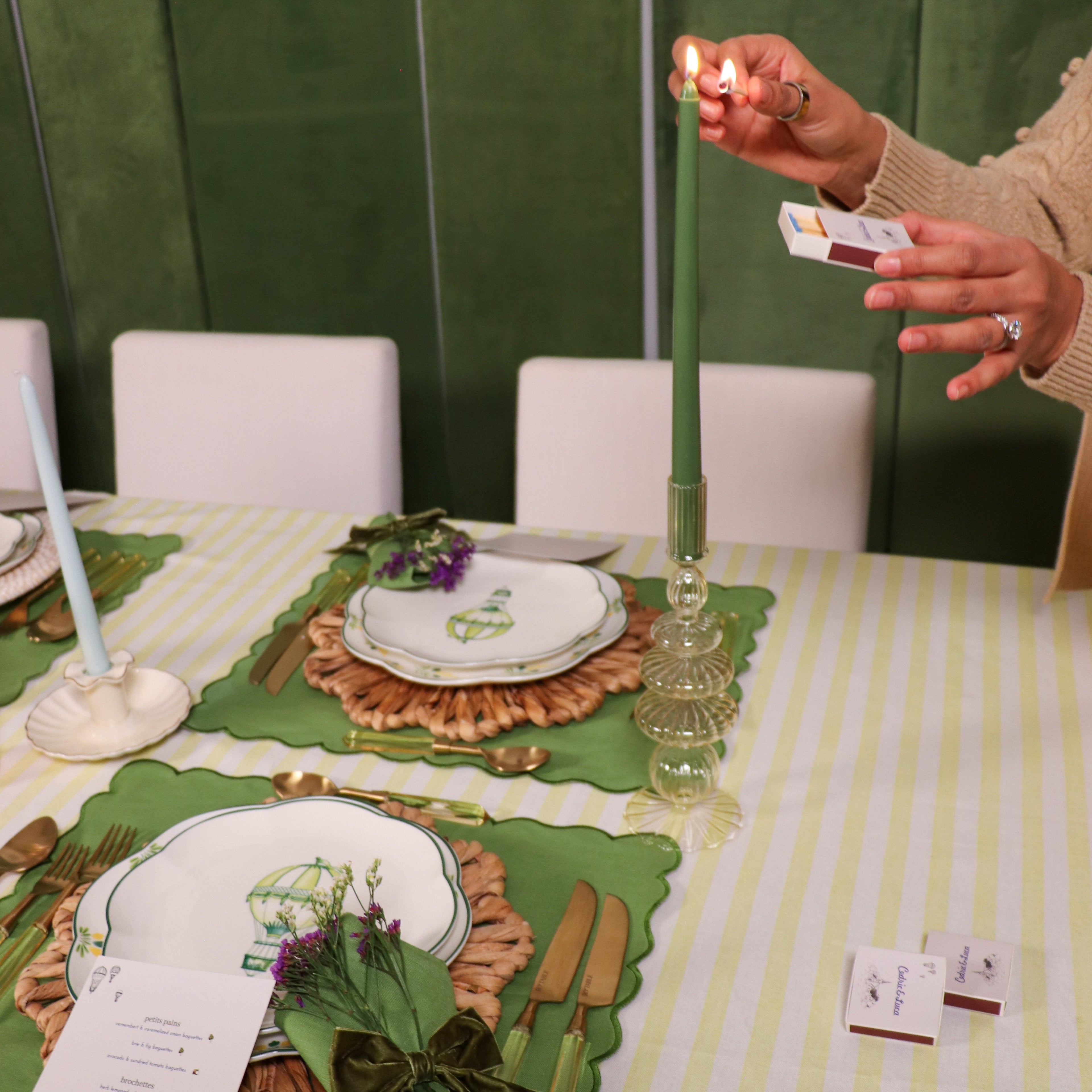 Lifestyle photo showing Extra Tall Pine Green Taper Candle, 1 Case of 48 Packs (4 Candles in use - Ro'Table