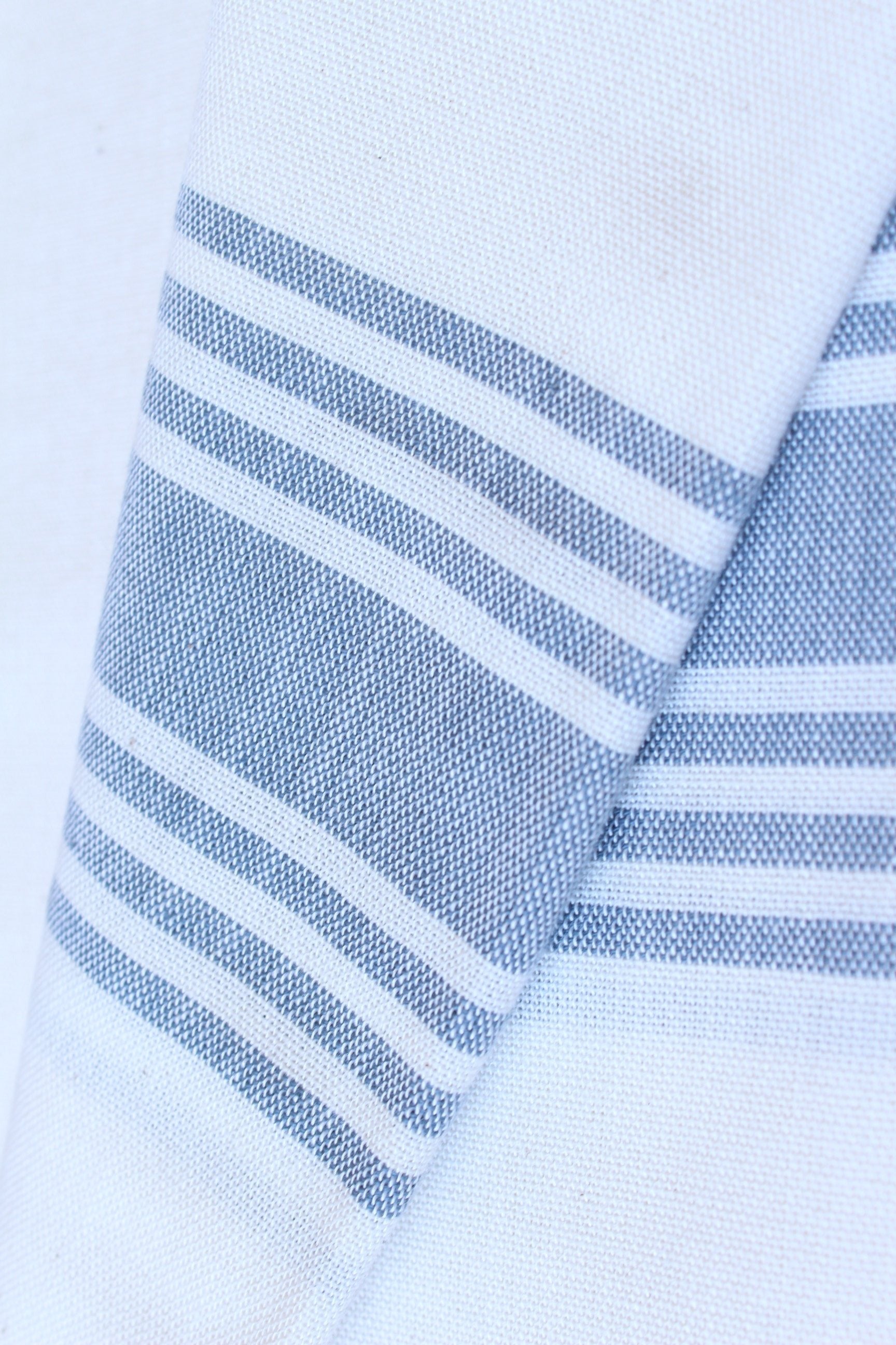 Lifestyle photo showing Symi - White in use - Beach House Towels