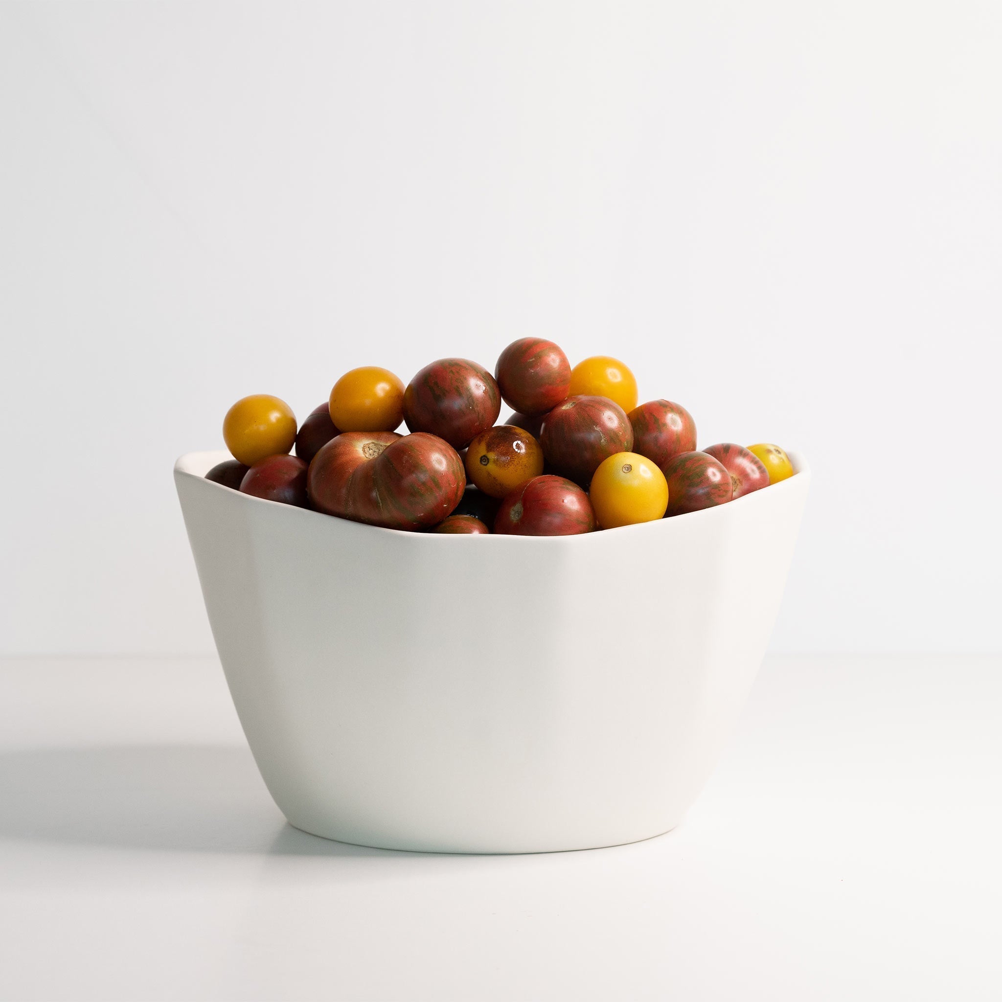 Lifestyle photo showing Medium Porcelain Nesting Bowl in use - Ember Collective