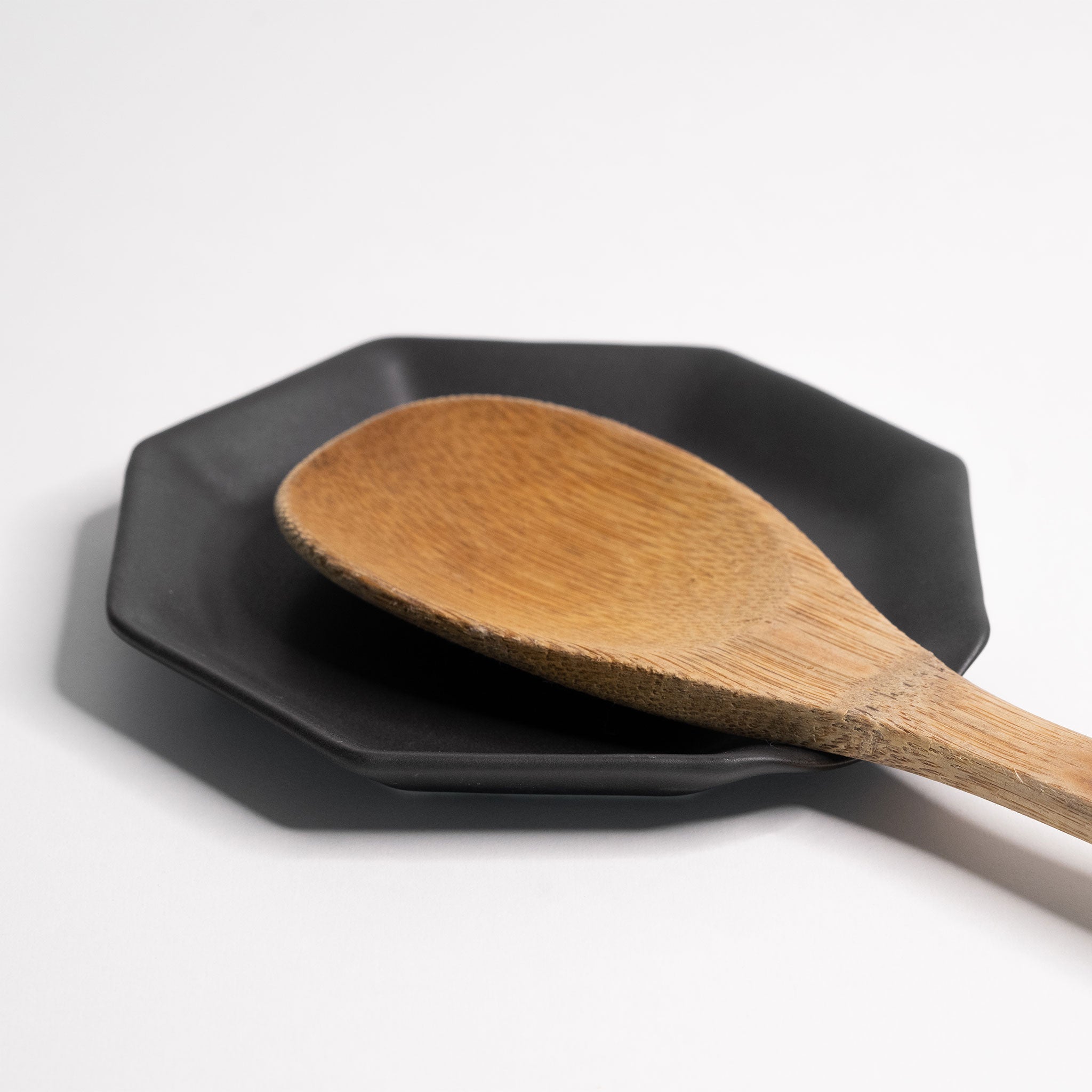 Lifestyle photo showing Handmade Porcelain Spoon Rest in use - Ember Collective