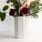 Lifestyle photo showing Handmade Porcelain Bouquet Vase in use - Ember Collective