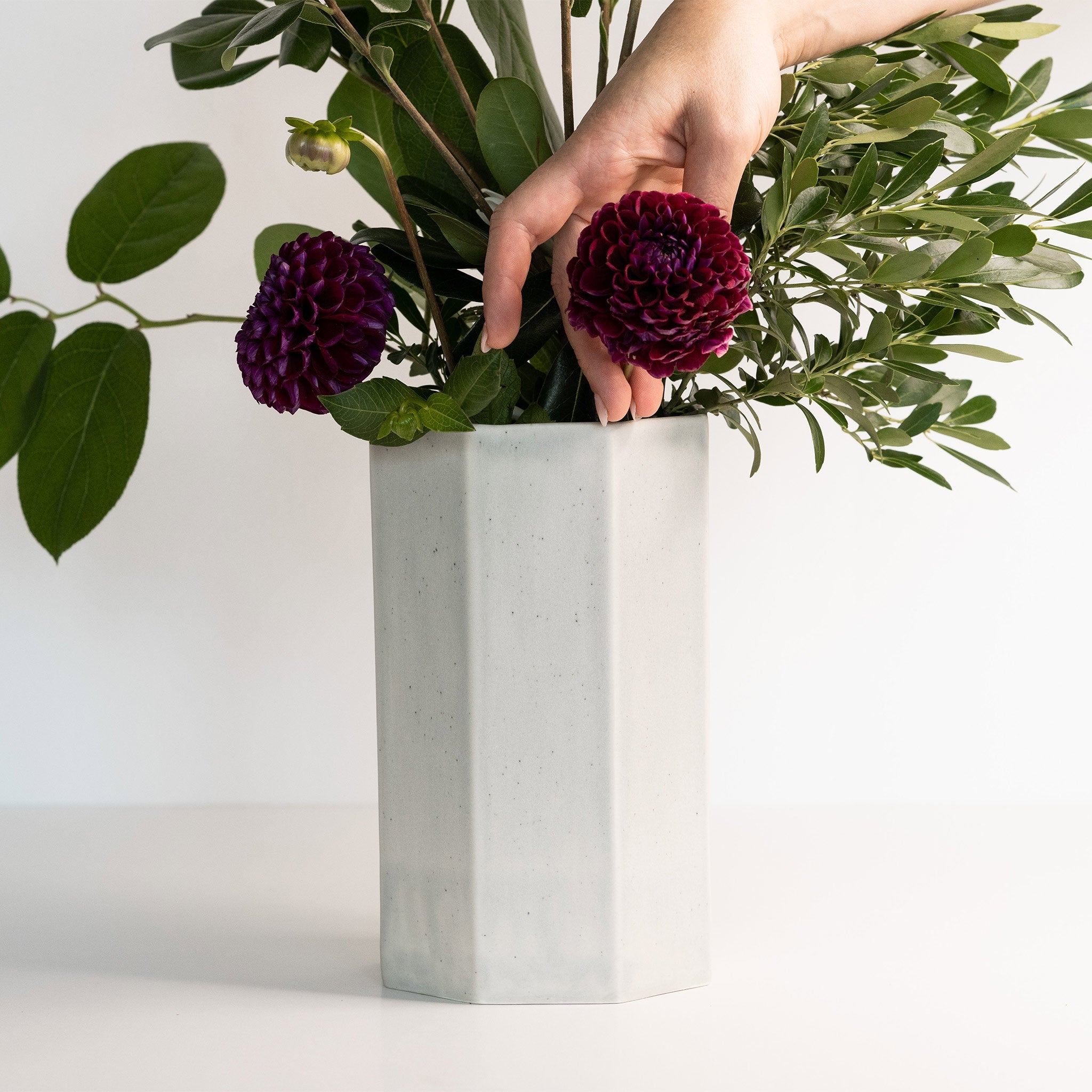 Lifestyle photo showing Handmade Porcelain Bouquet Vase in use - Ember Collective