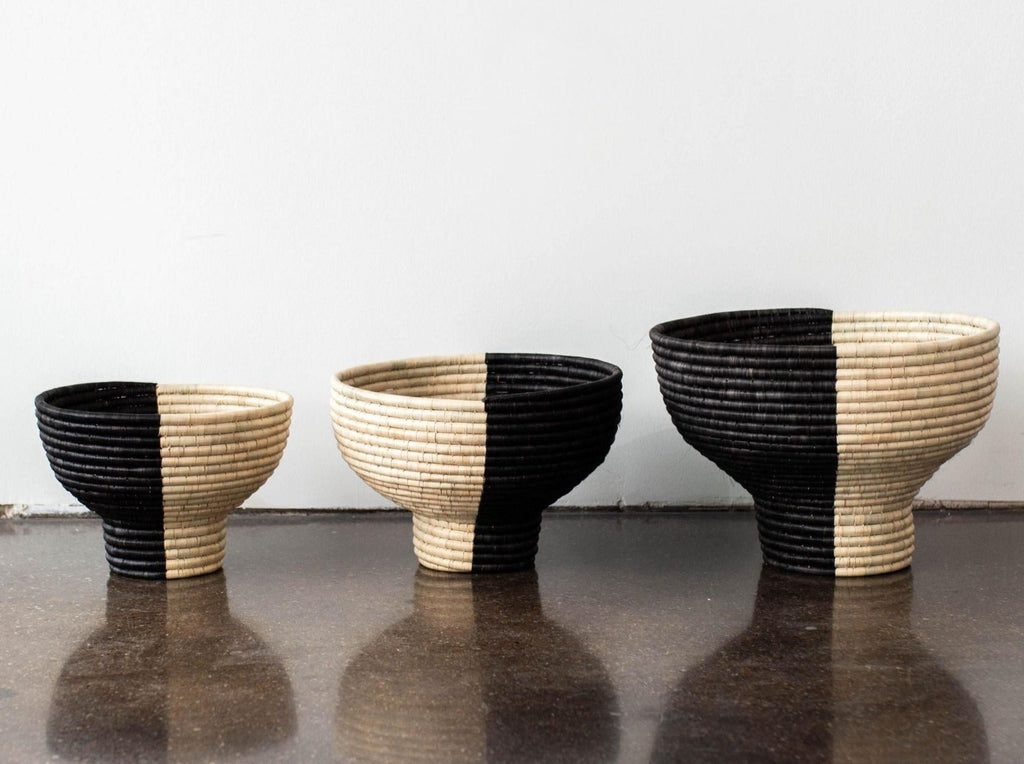 Lifestyle photo showing Pedestal Black and Natural Basket Bowl in use - Kanju Interiors