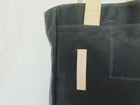 Lifestyle photo showing Charcoal Grey Wax Canvas Tote Bag - The Morning Person in use - notebooks & honey