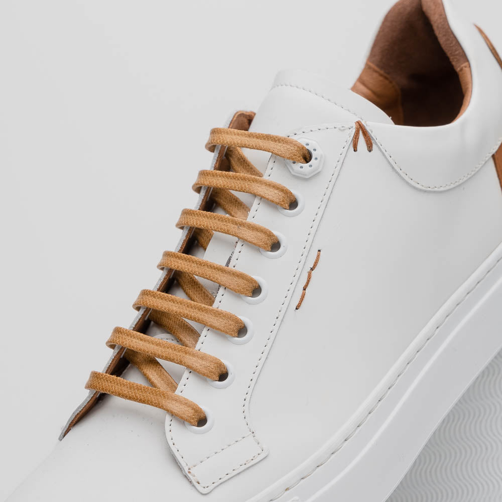 Lifestyle photo showing 65-229-WHT Diaz Rubberized Calfskin Sneaker White in use - Zelli Italia