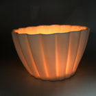 Lifestyle photo showing Elysian Fluted Porcelain Candle Holder in use - Ember Collective