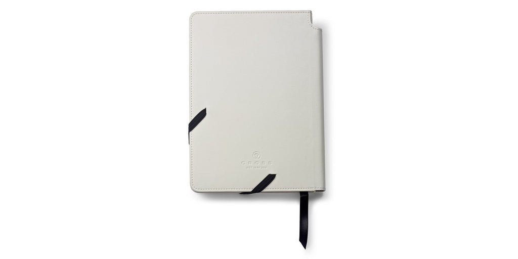 Lifestyle photo showing A.T. Cross Medium Classic White Journal - Natural Left-Handed Com in use - A.T. Cross