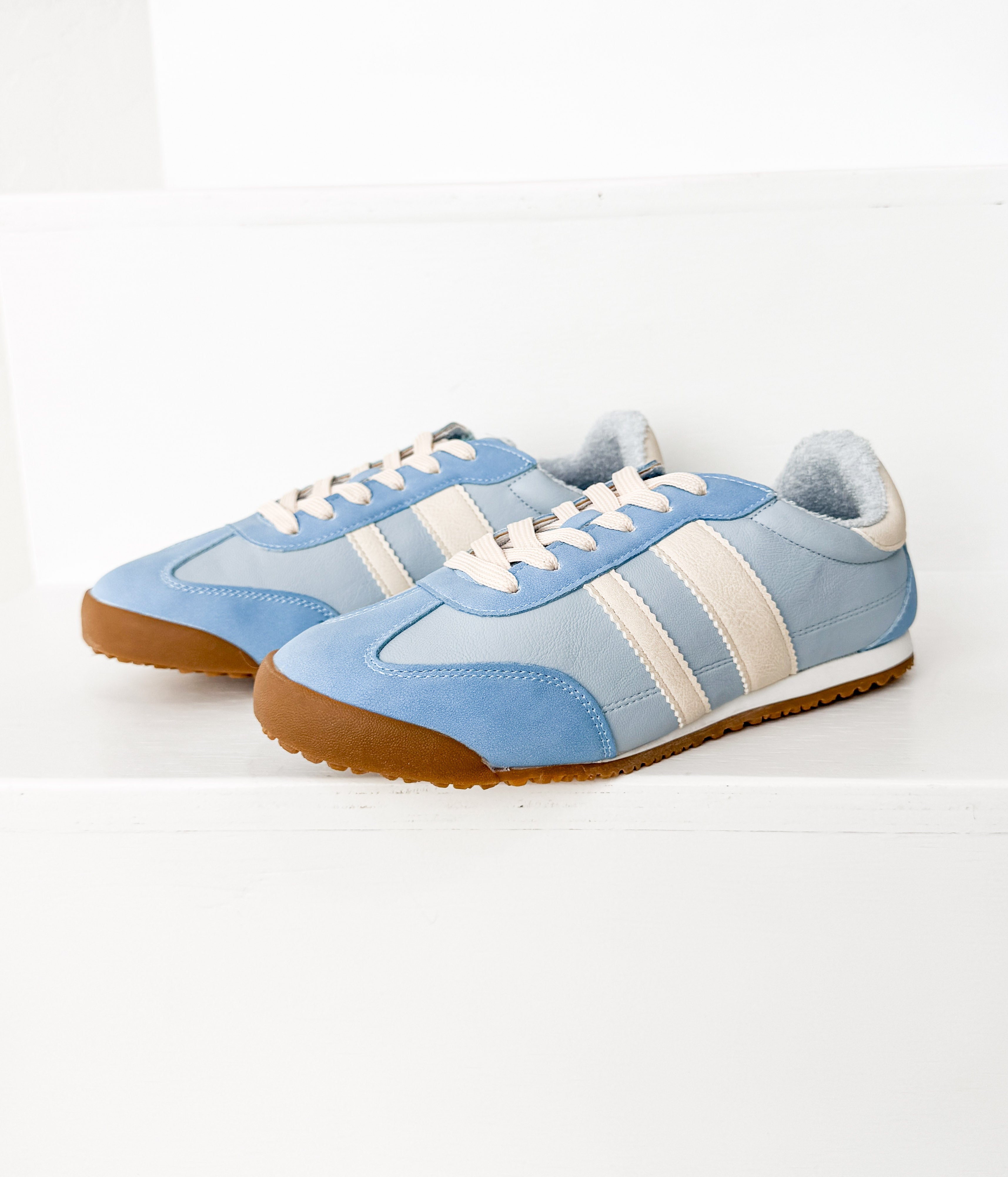 Lifestyle photo showing Madrid Sneaker in Light Blue in use - Naughty Monkey