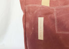 Lifestyle photo showing Mauve Wax Canvas Tote Bag - The Rebel Gal in use - notebooks & honey