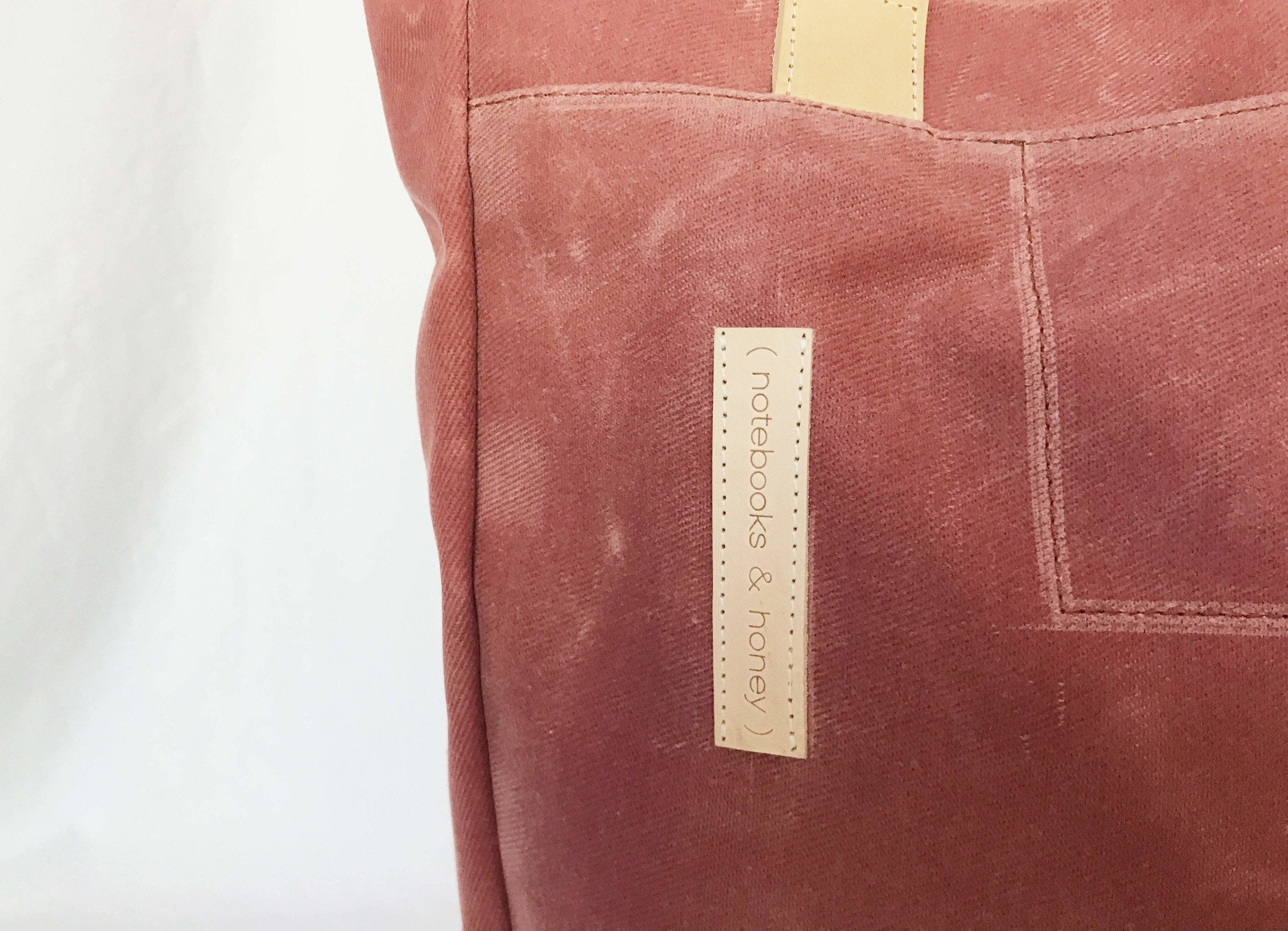 Lifestyle photo showing Mauve Wax Canvas Tote Bag - The Rebel Gal in use - notebooks & honey