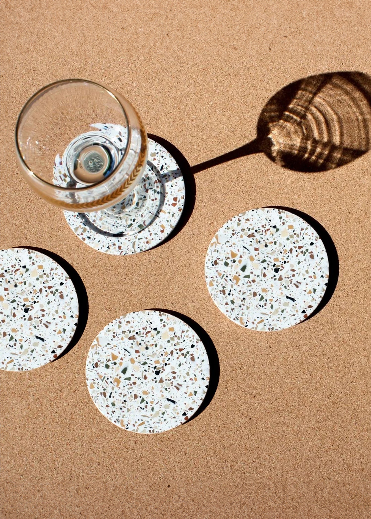 Lifestyle photo showing Neutral Terrazzo Coasters - Set of 4 in use - Kanju Interiors