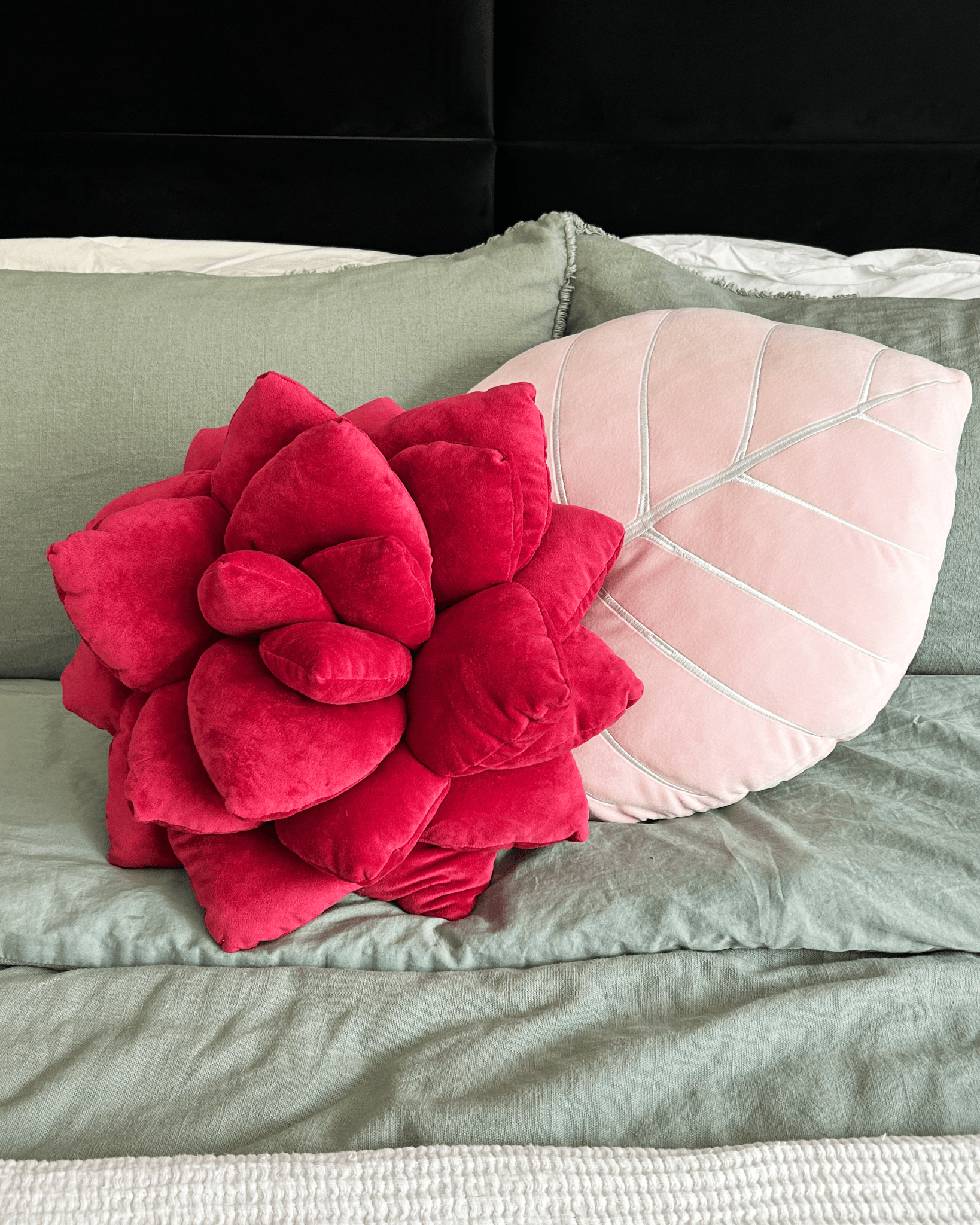 Lifestyle photo showing Philodendron Gloriosum Leaf Plush Pillow - Baby Pink in use - Green Philosophy Co.